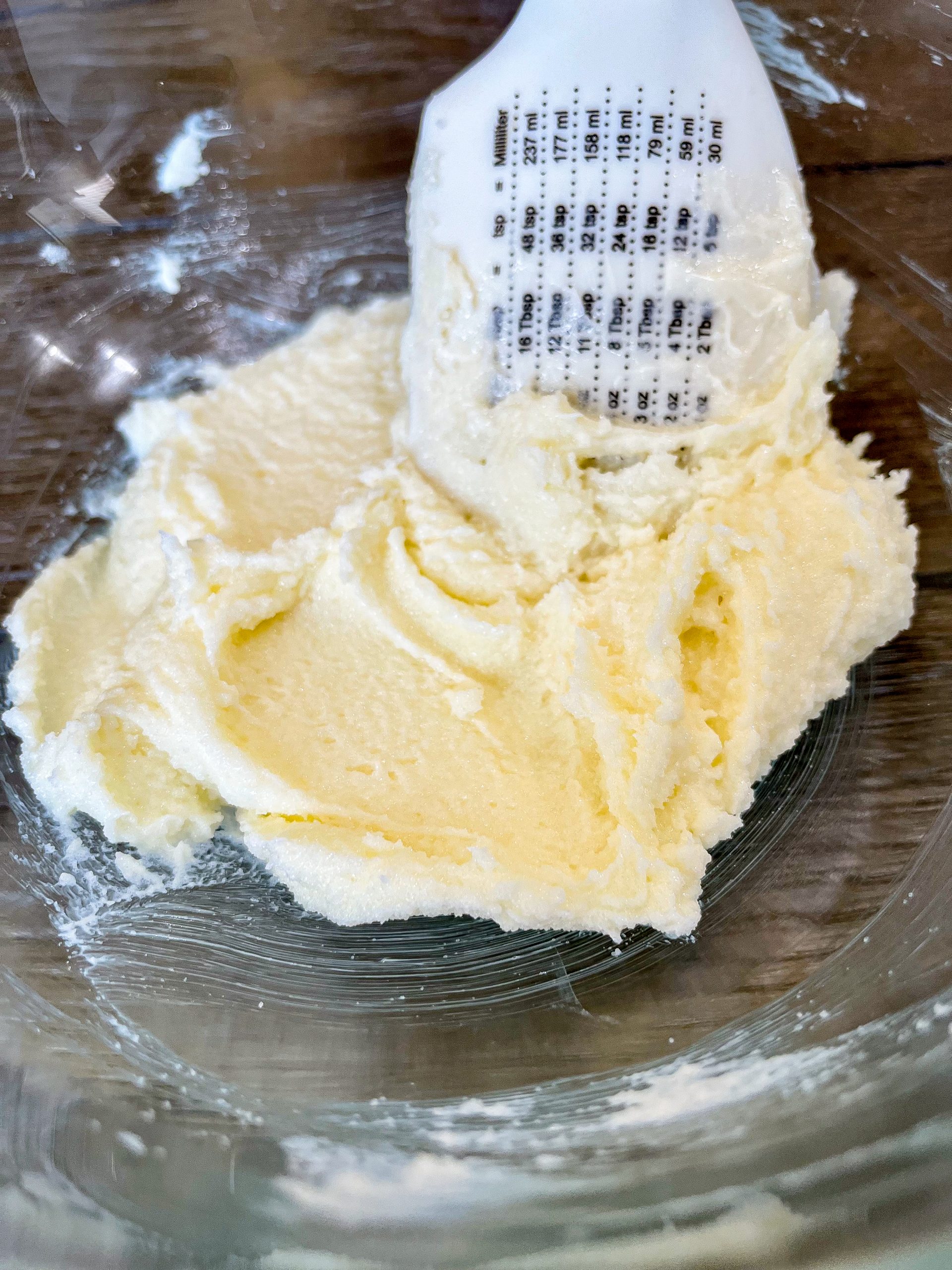 Cream together the butter and sugar in a separate bowl. 