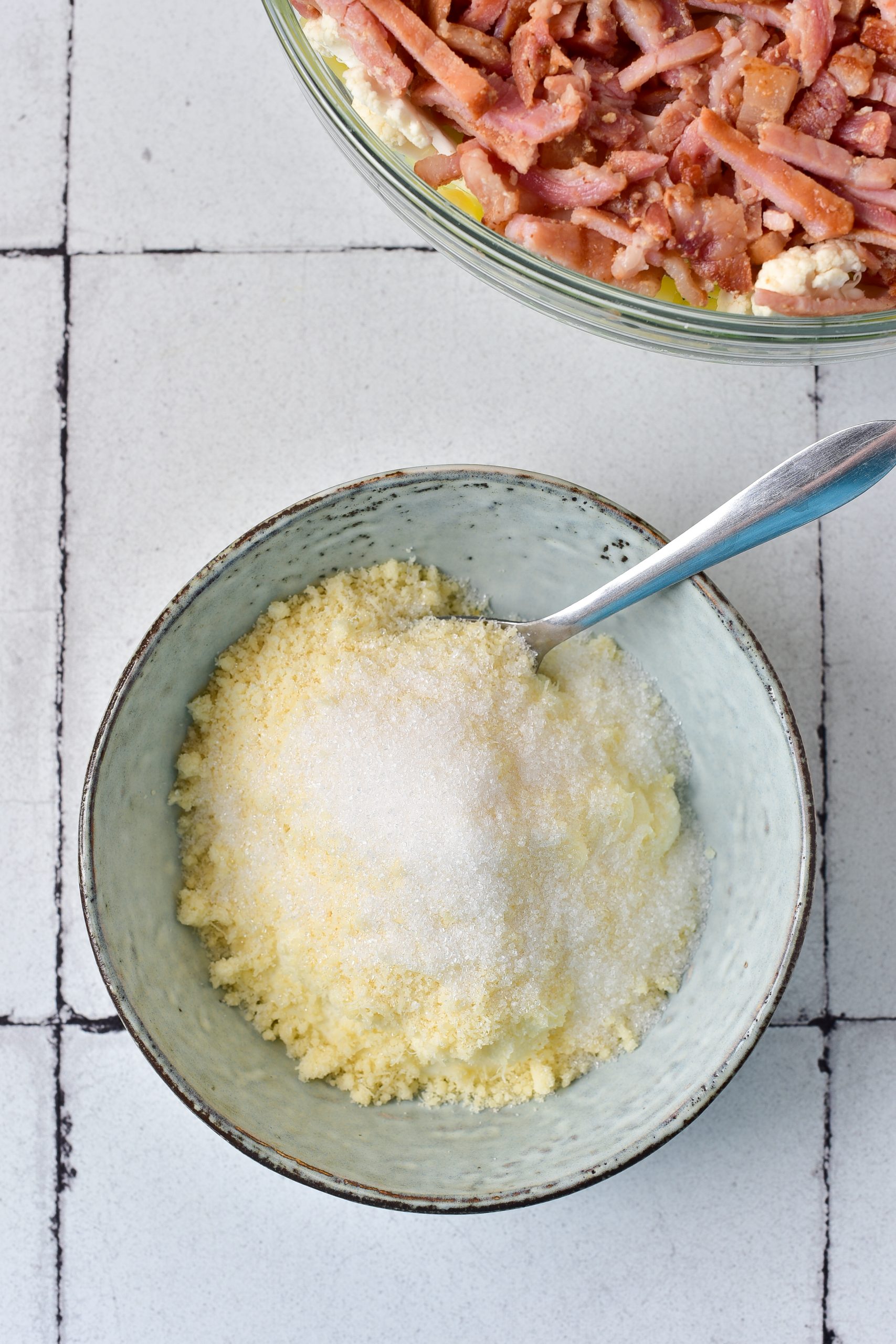 In a bowl, whisk together the mayonnaise, sugar, and parmesan cheese.