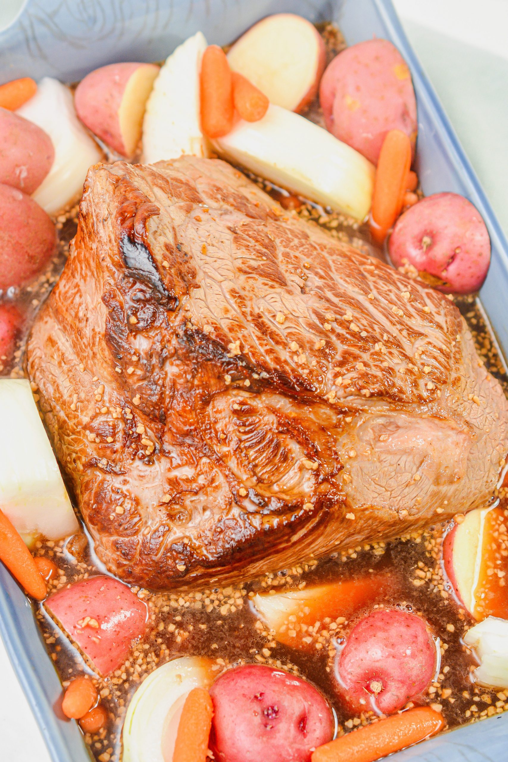 Pour the sauce mixture over the roast and vegetables in the dish, and bake for 3 hours.