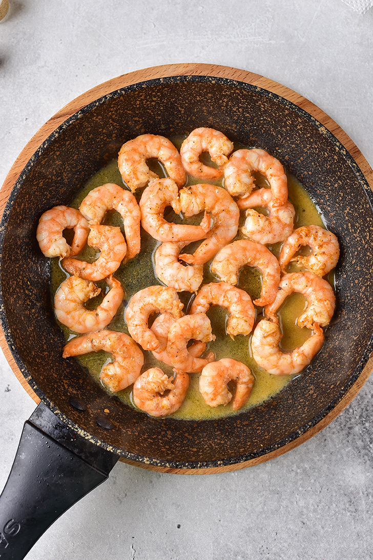 Place the oil in a skillet over medium-high heat, add the shrimp and saute until cooked through. 