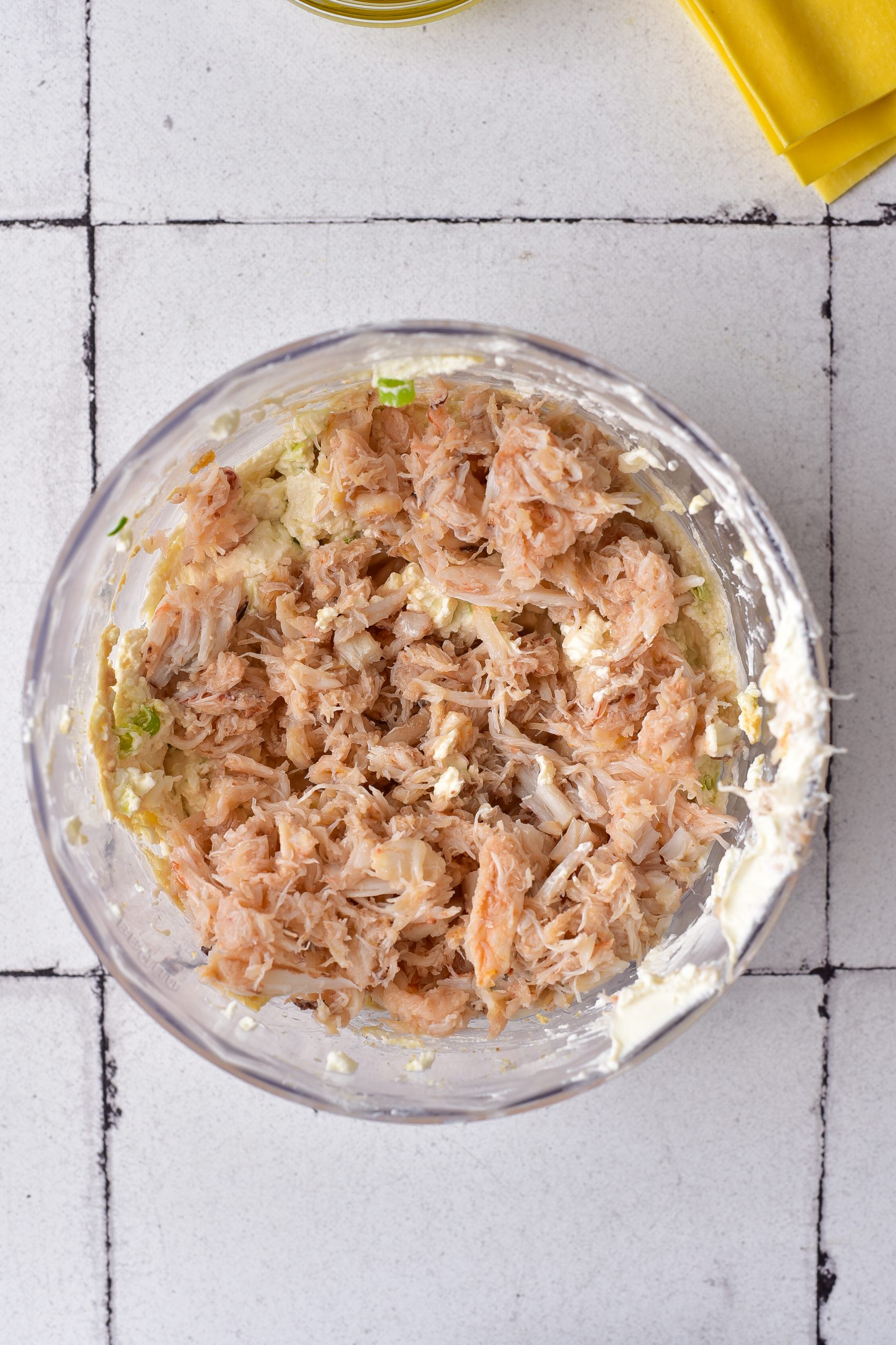 Fold the crab meat into the mixture. 
