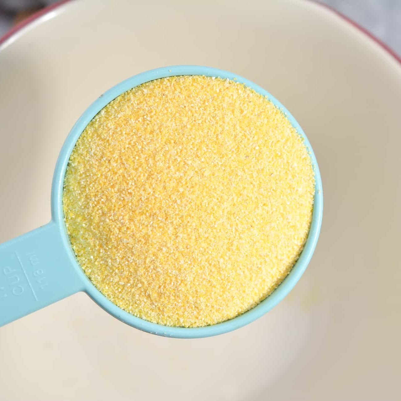 In a bowl, add the cornmeal.