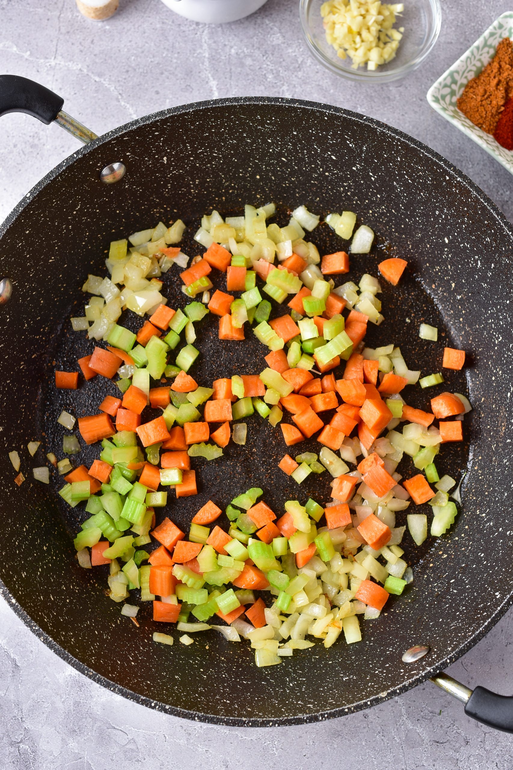 Stir in the onions, carrots, and celery, and saute for about 5 minutes until beginning to soften. 