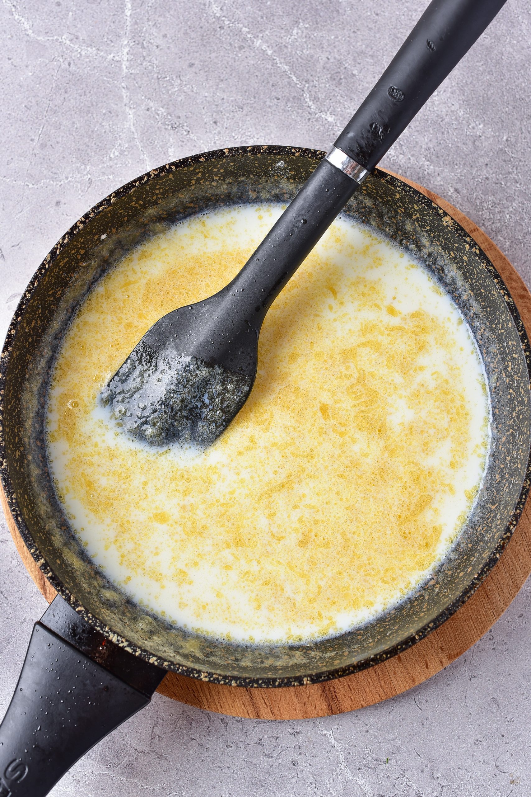 Simmer the mixture until it is golden brown, and then carefully whisk the milk in a little at a time. 