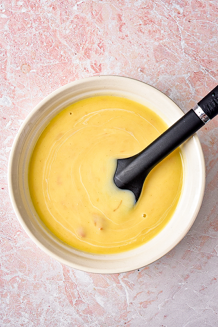 In a bowl, whisk together the rest of the evaporated milk, water, and cream of chicken soup. 