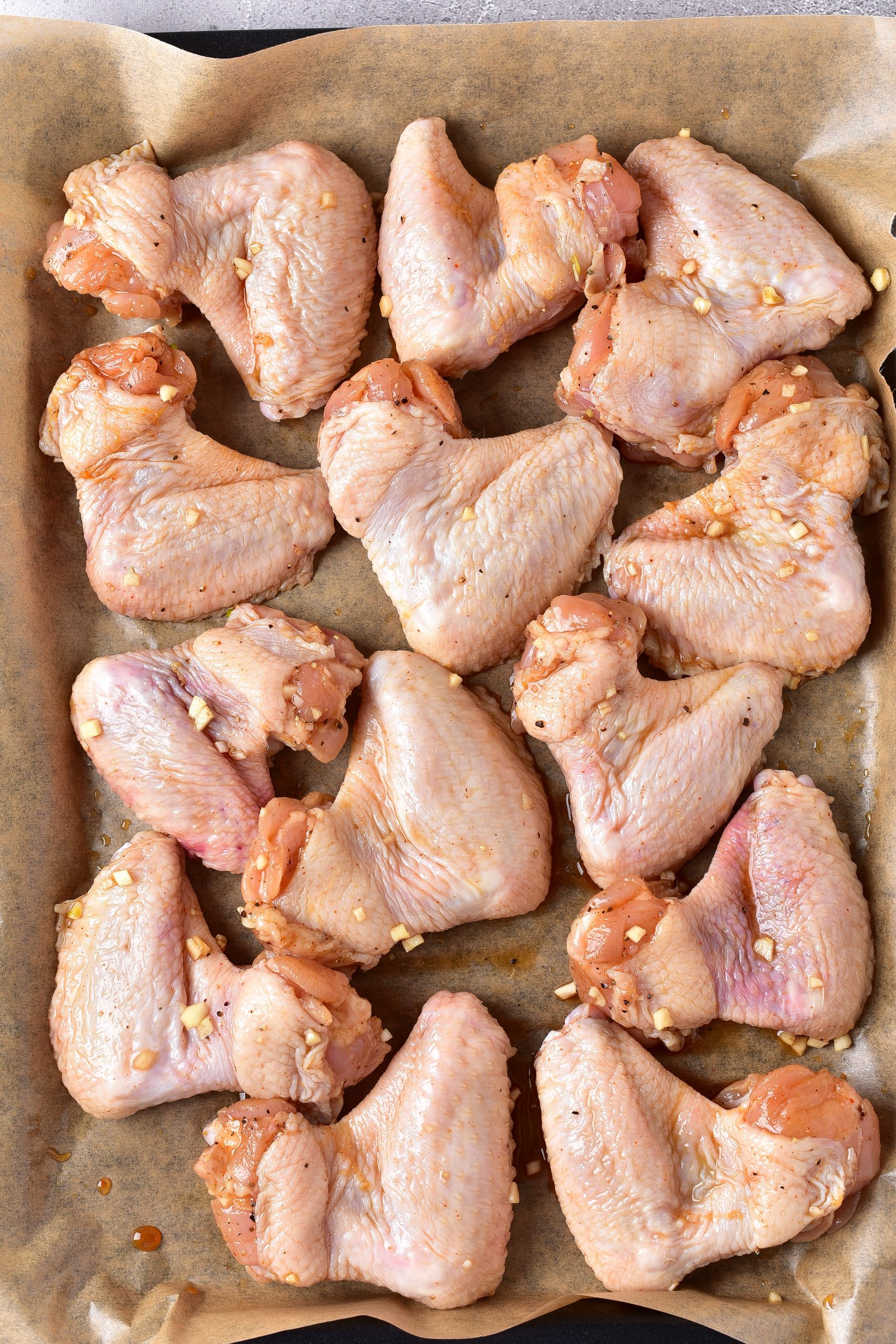 Layer the wings on the baking sheet, and bake for 25-30 minutes, or until completely cooked through. 