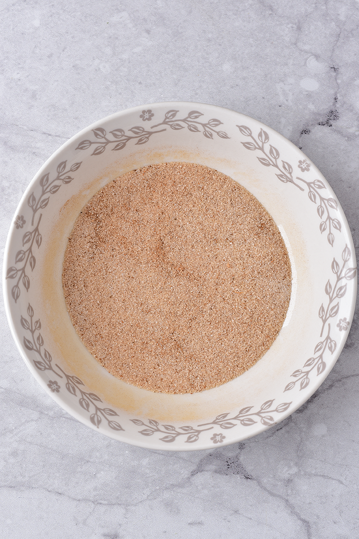 Stir together the 1 Tbsp cinnamon and ⅓ cup sugar in a shallow bowl.