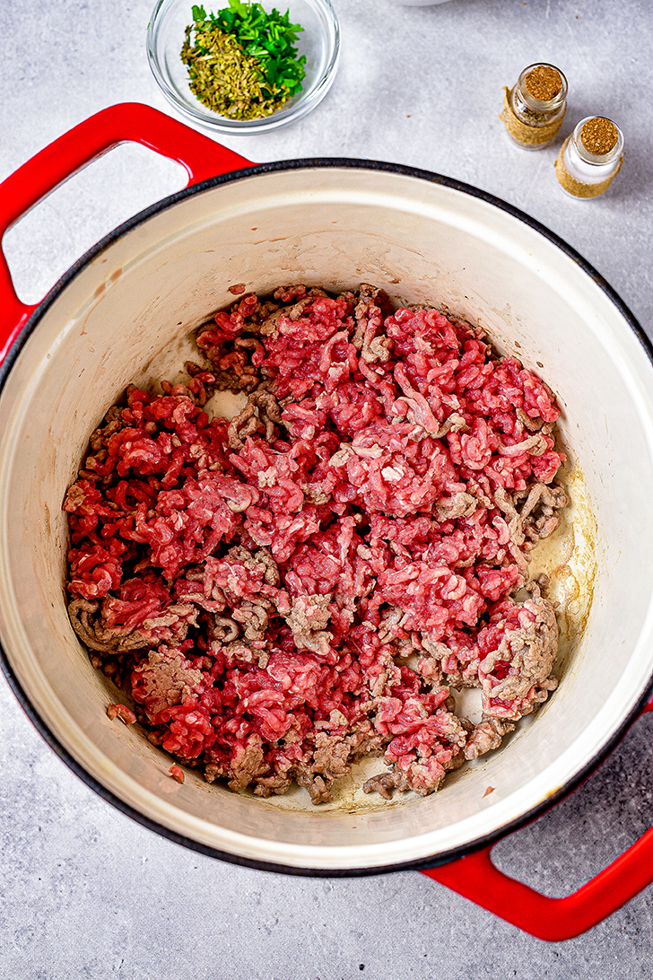 Add the ground beef to a skillet and saute until the meat is browned. 