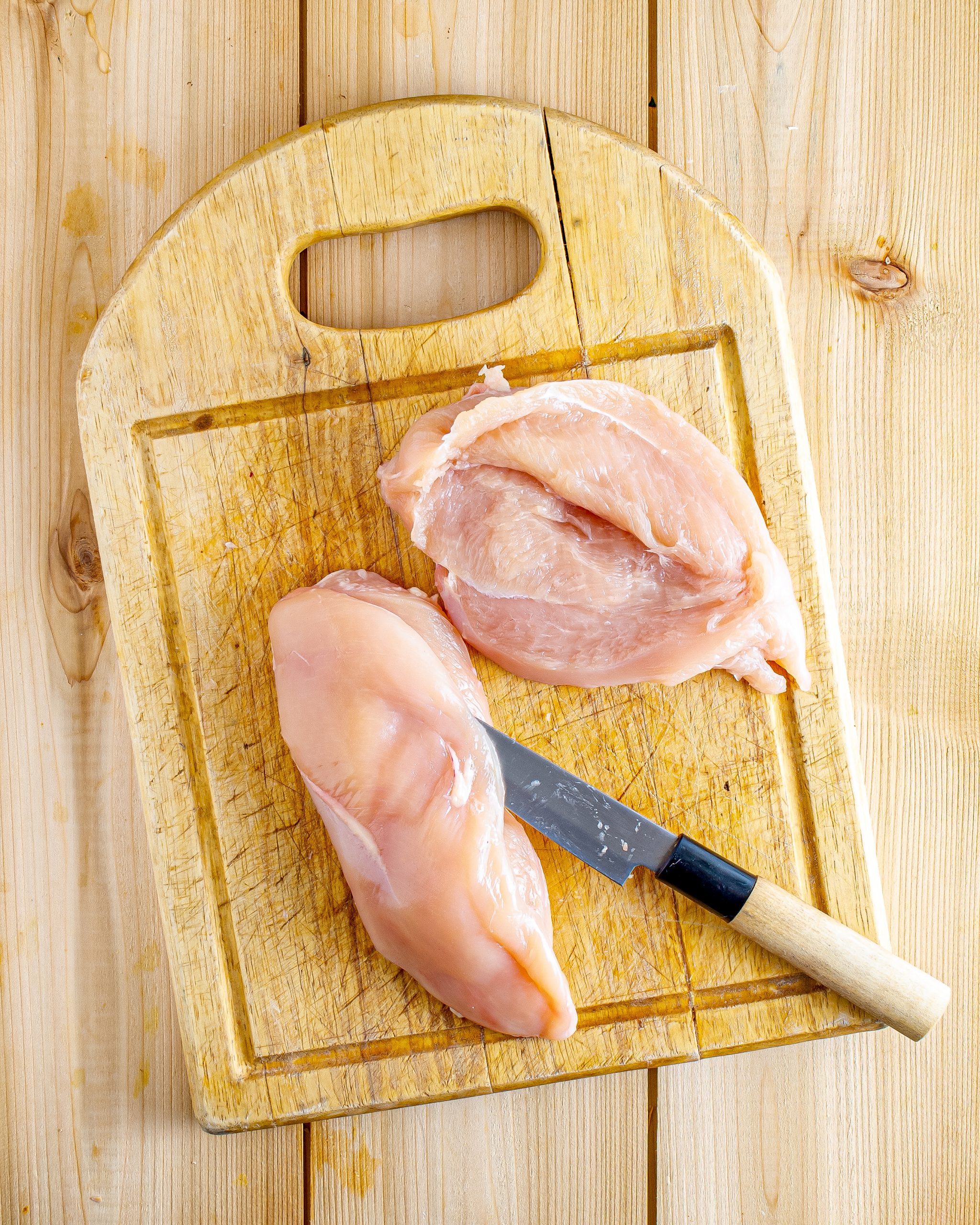 Slice the chicken vertically on the side to form a pocket in each breast. Be careful not to slice the chicken breast all the way through.