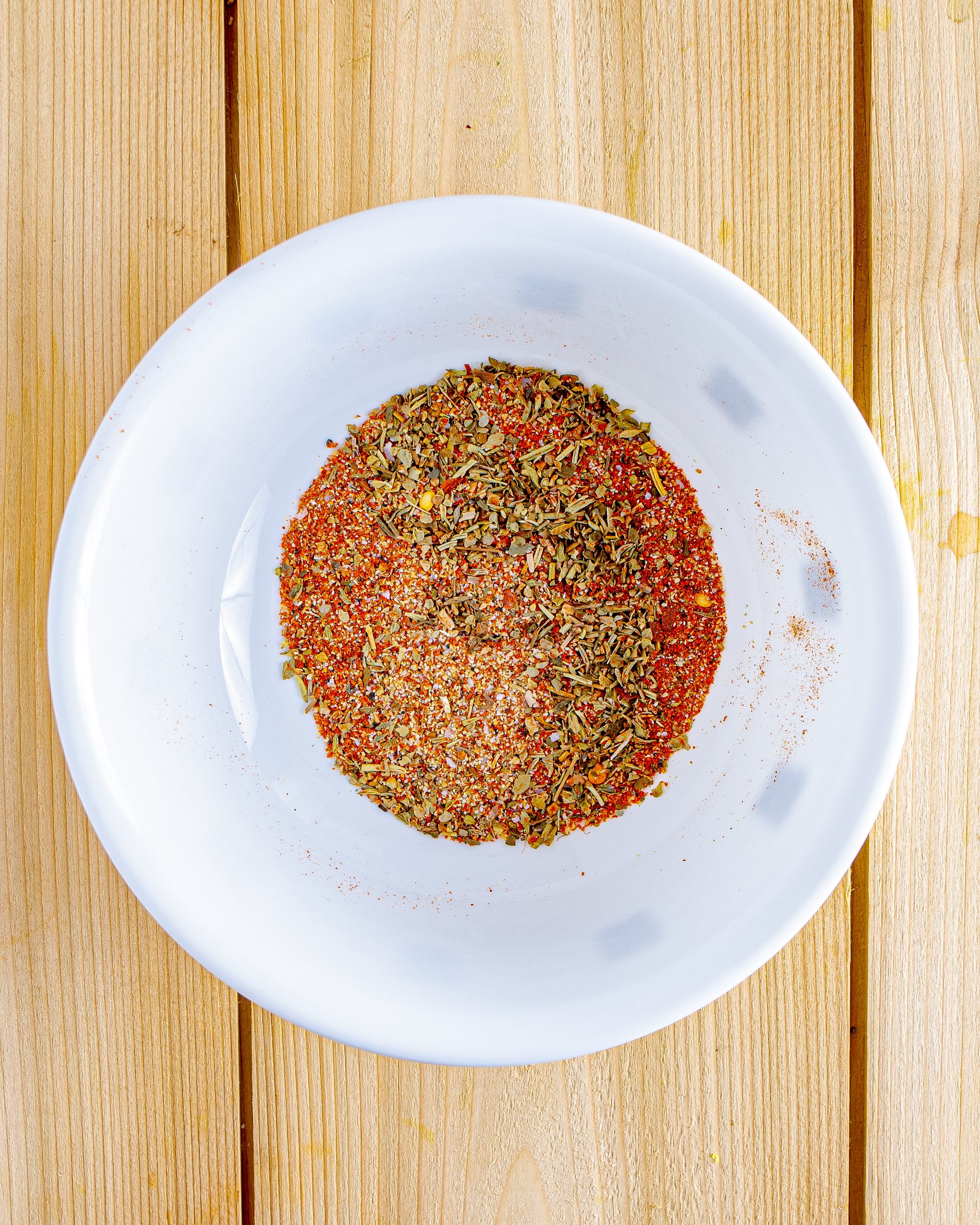 In a small bowl, combine the Italian seasoning, garlic powder, paprika, salt, and pepper.