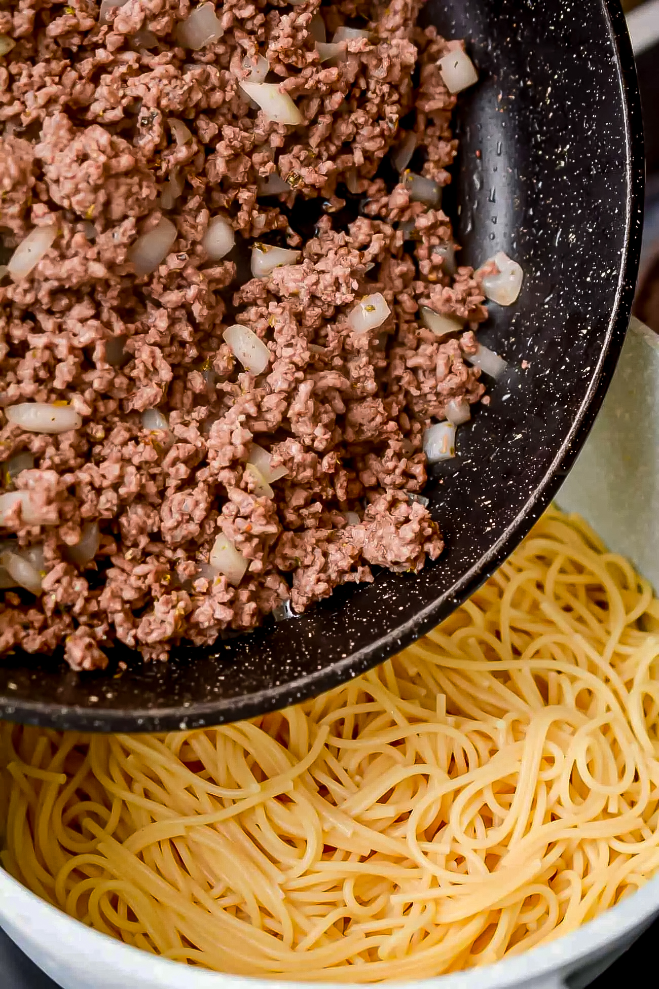 Mix together the spaghetti noodles and the meat mixture.