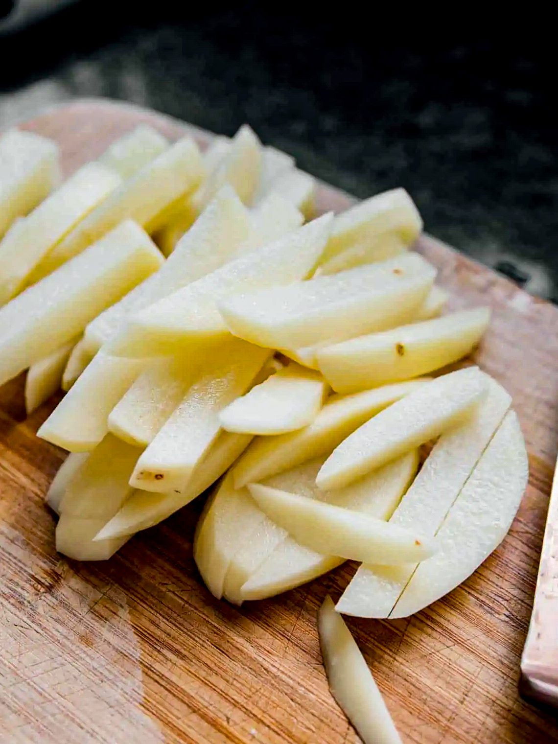 Slice your peeled potatoes into thin cuts