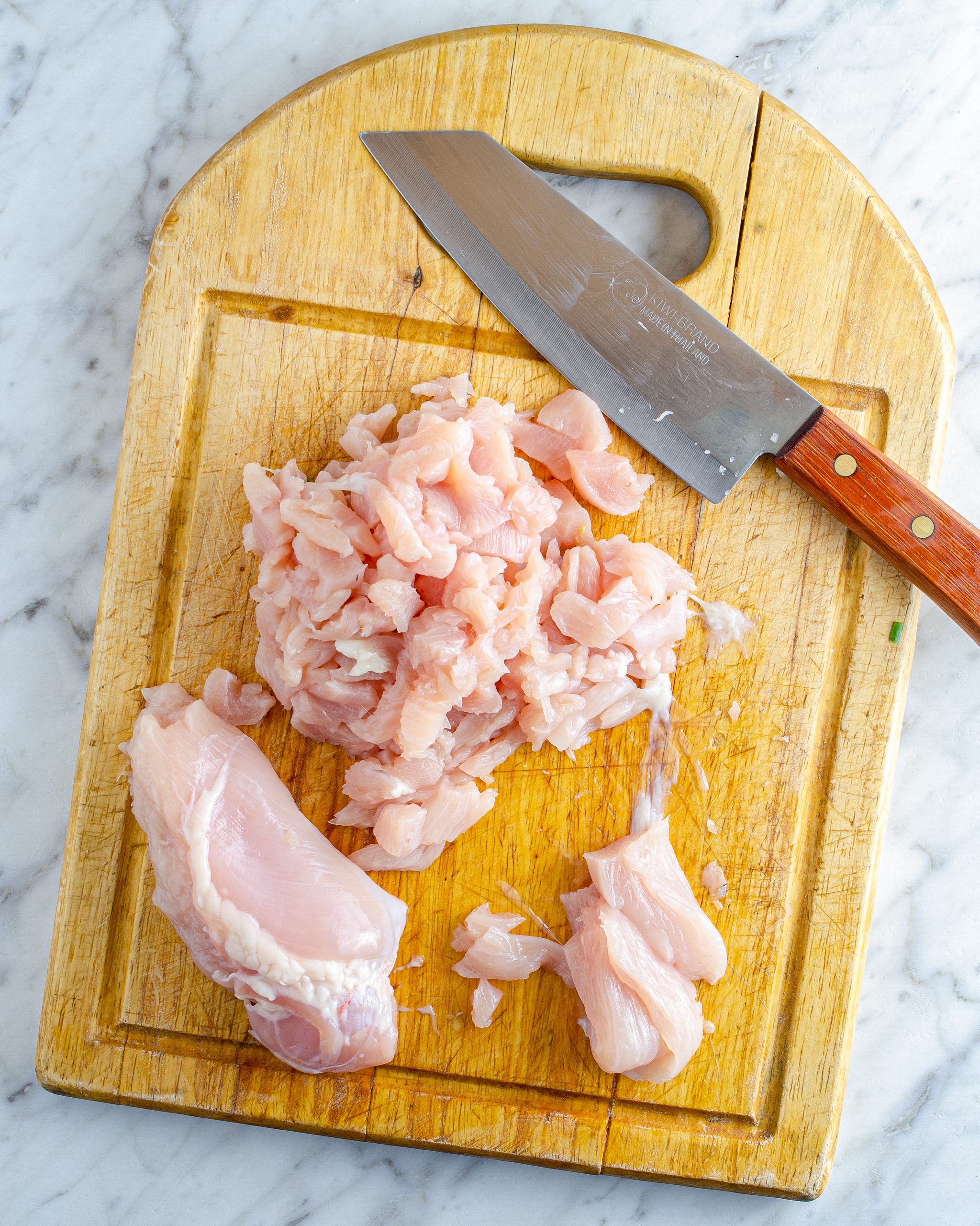 Slice the chicken breast into very thin pieces. 