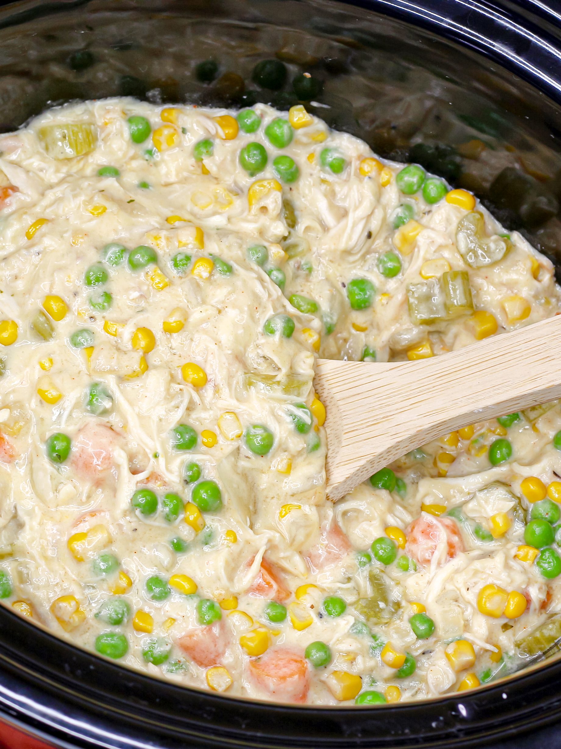 Add frozen peas, and shredded chicken and cook 1 hour longer or till heated through