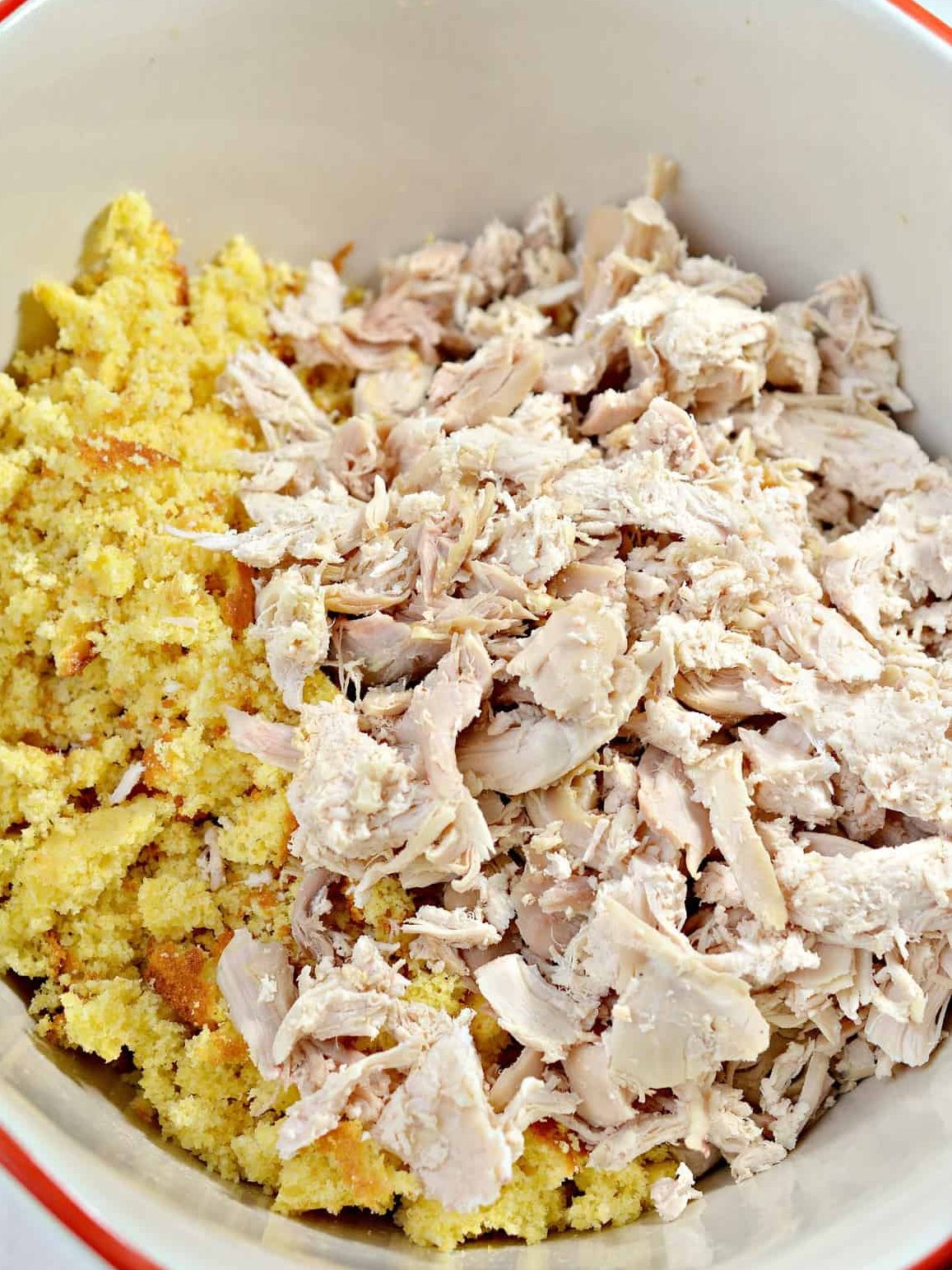 Place the cornbread and chicken into a large mixing bowl.