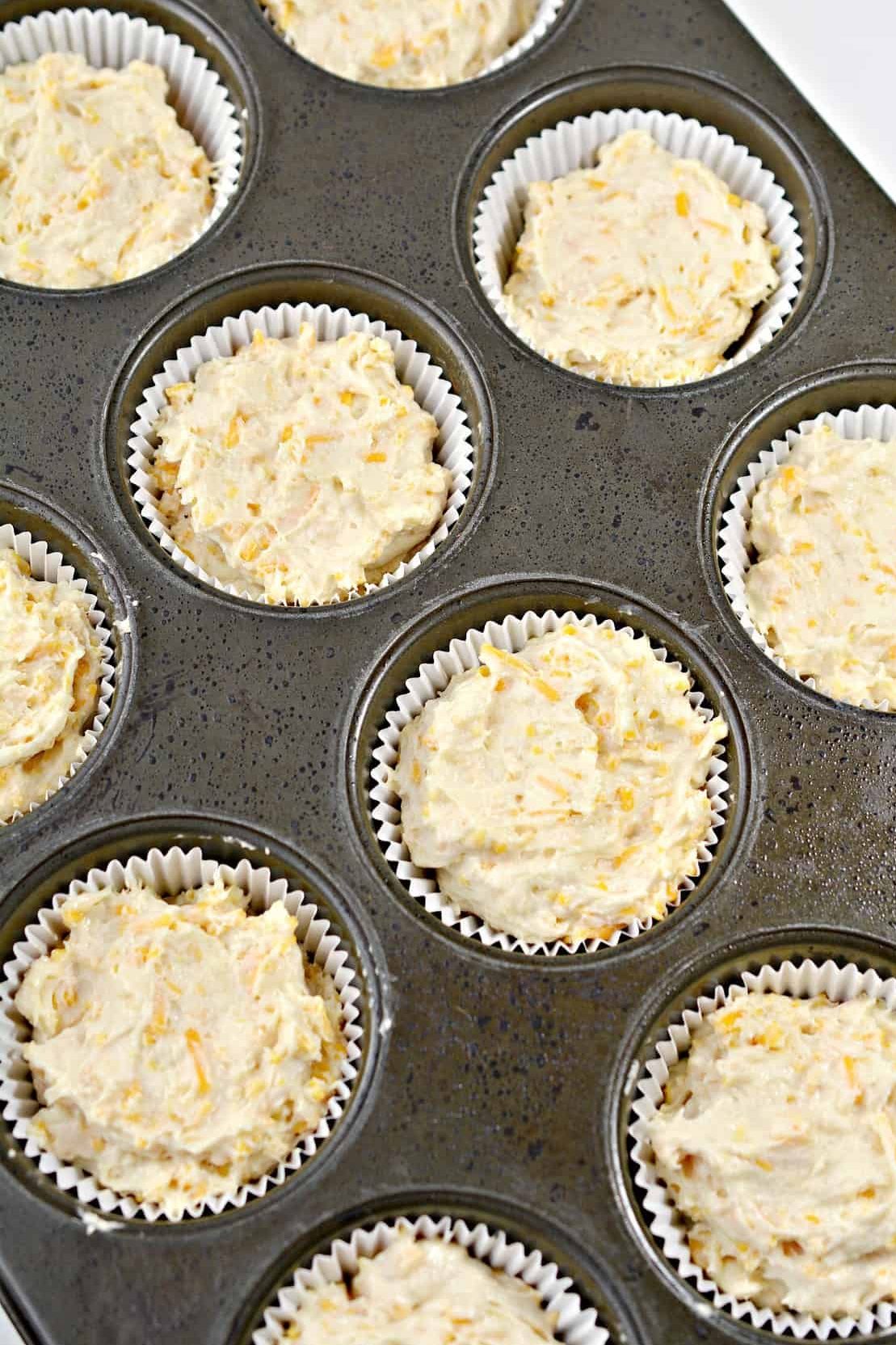 Spoon the batter into 12 sections of a muffin tin that have been well-greased or lined with cupcake liners. Fill each one to the top with the batter.