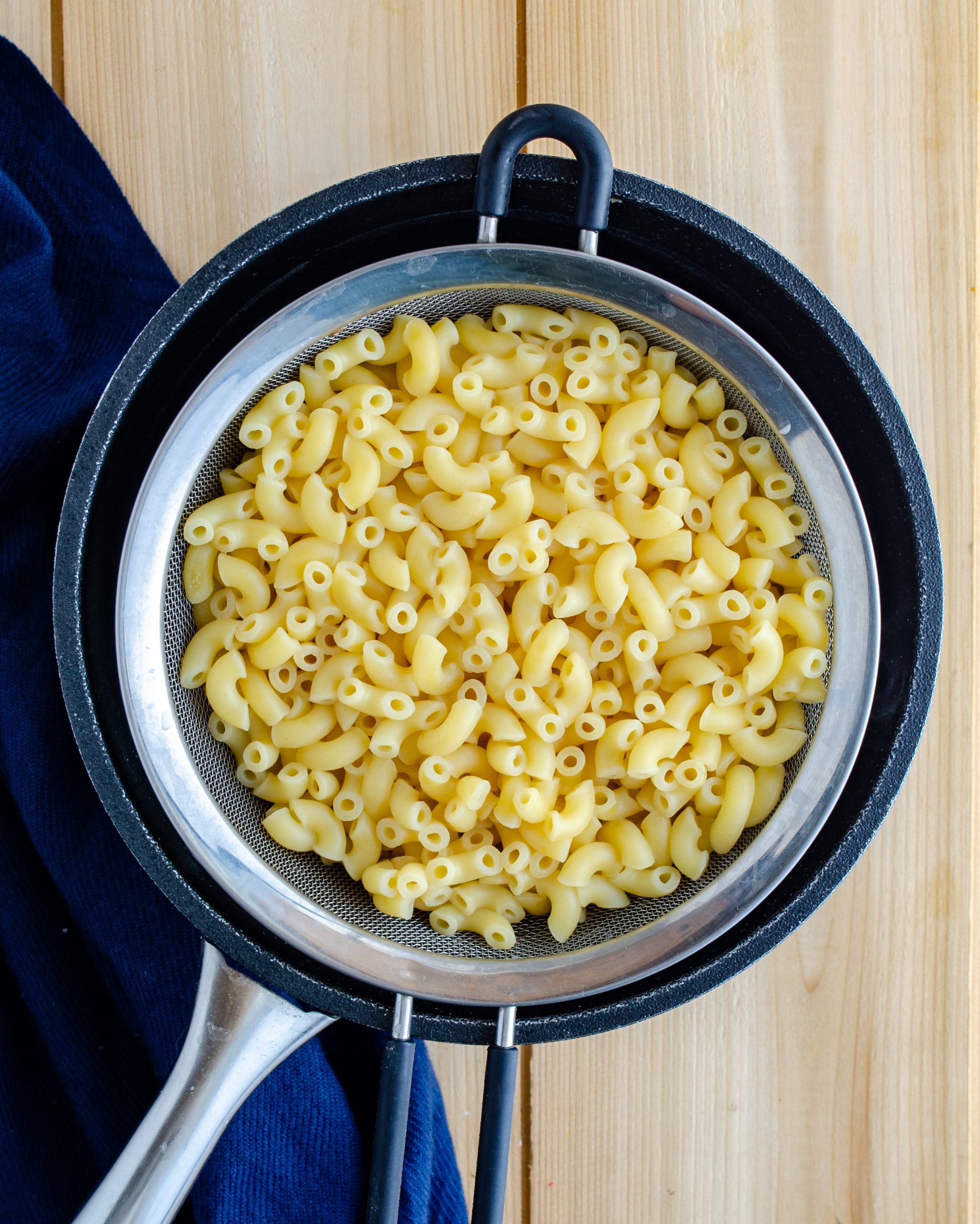 Cook the macaroni in boiling water until done to your liking. Rinse under cold water and drain well. 