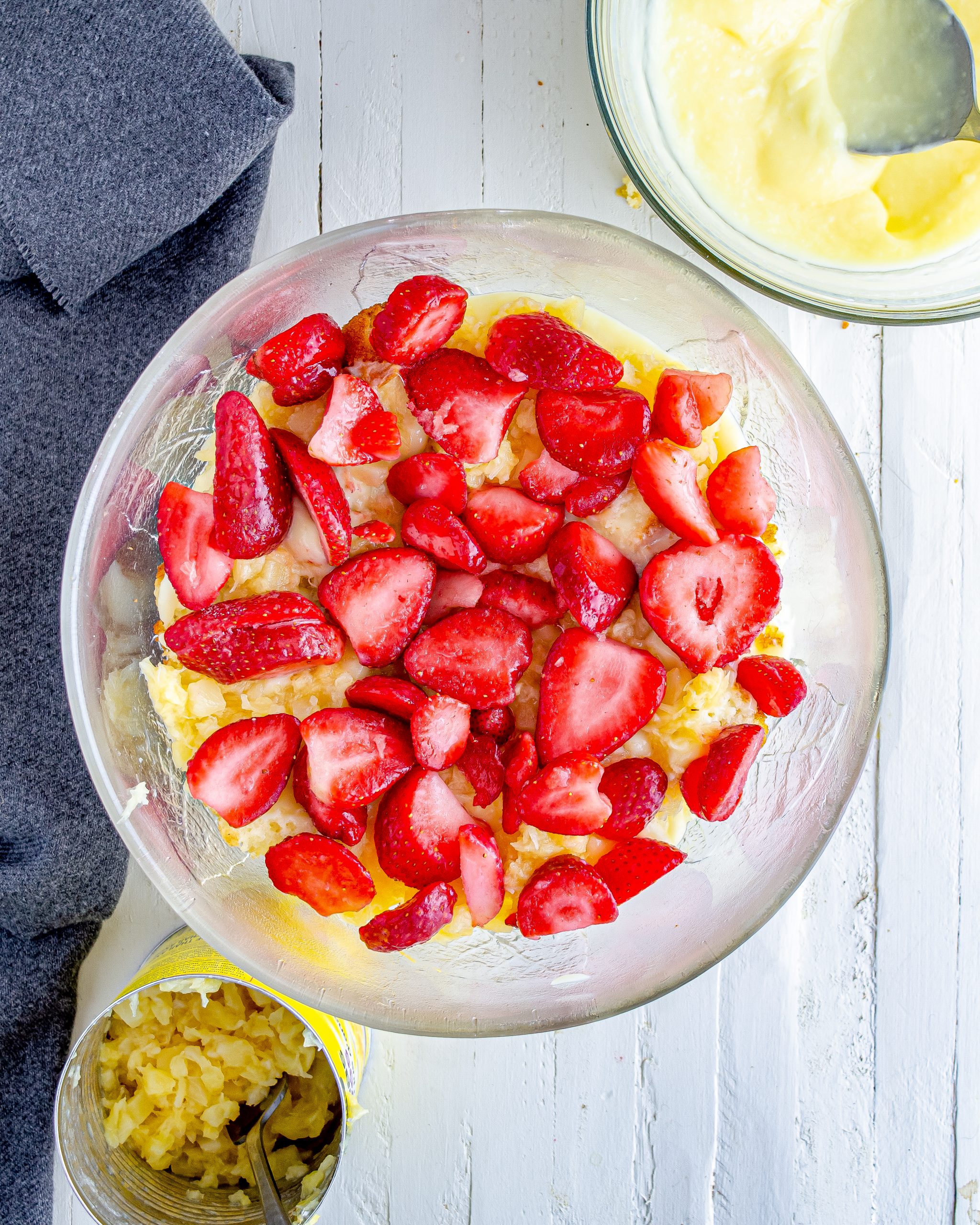 Add 1 package of strawberries to the serving bowl.