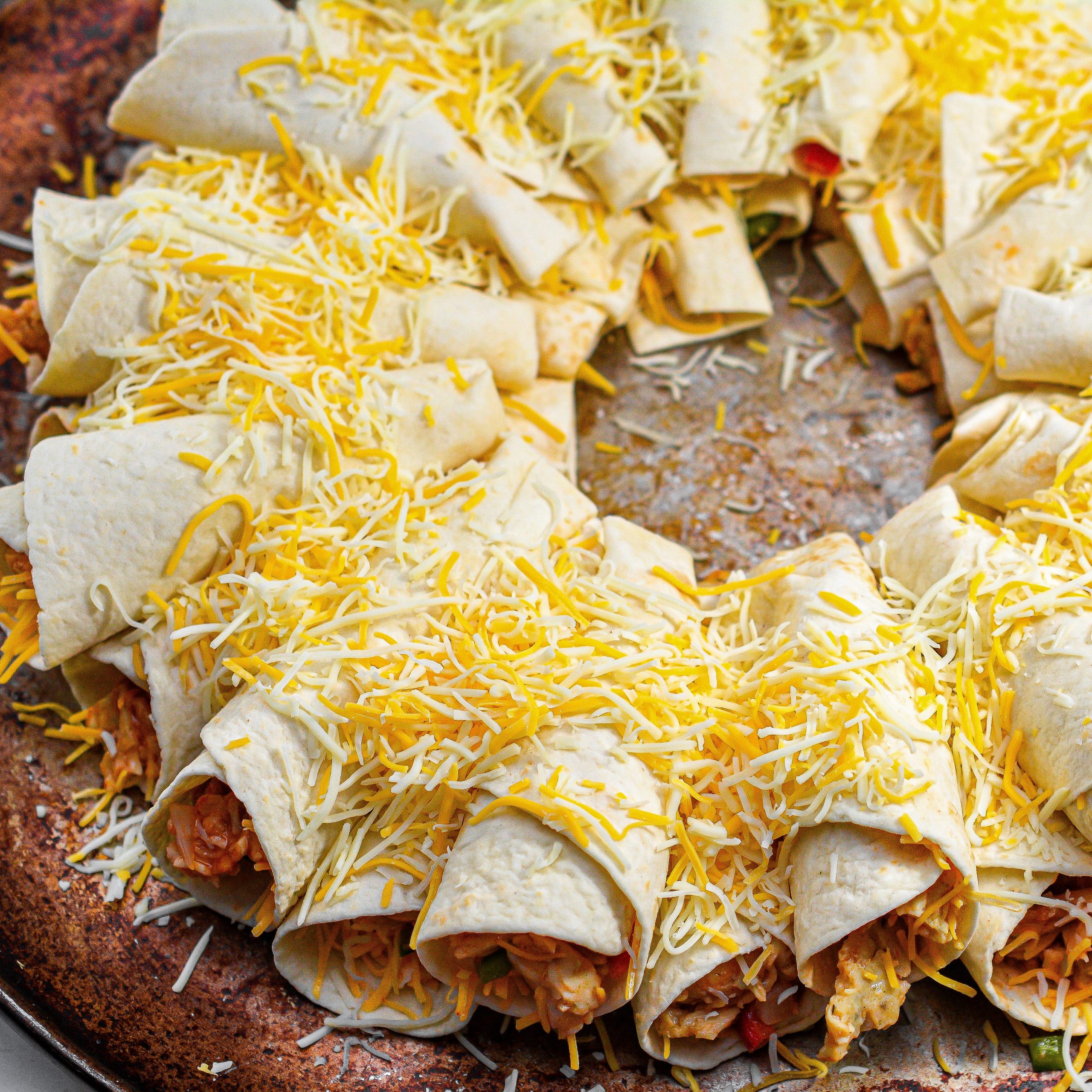 Once you have made one layer of tortilla cones, top them with the Mexican blend cheese.