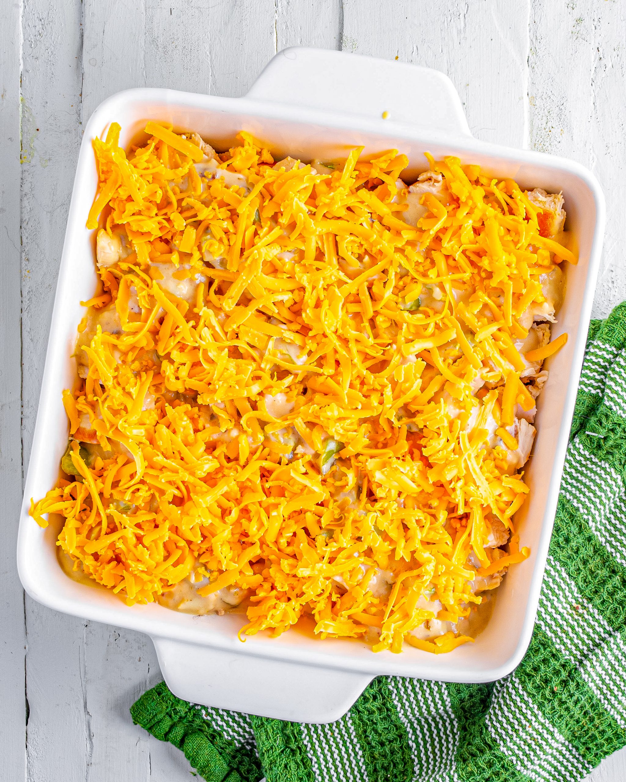 Layer the cheddar cheese on top. 