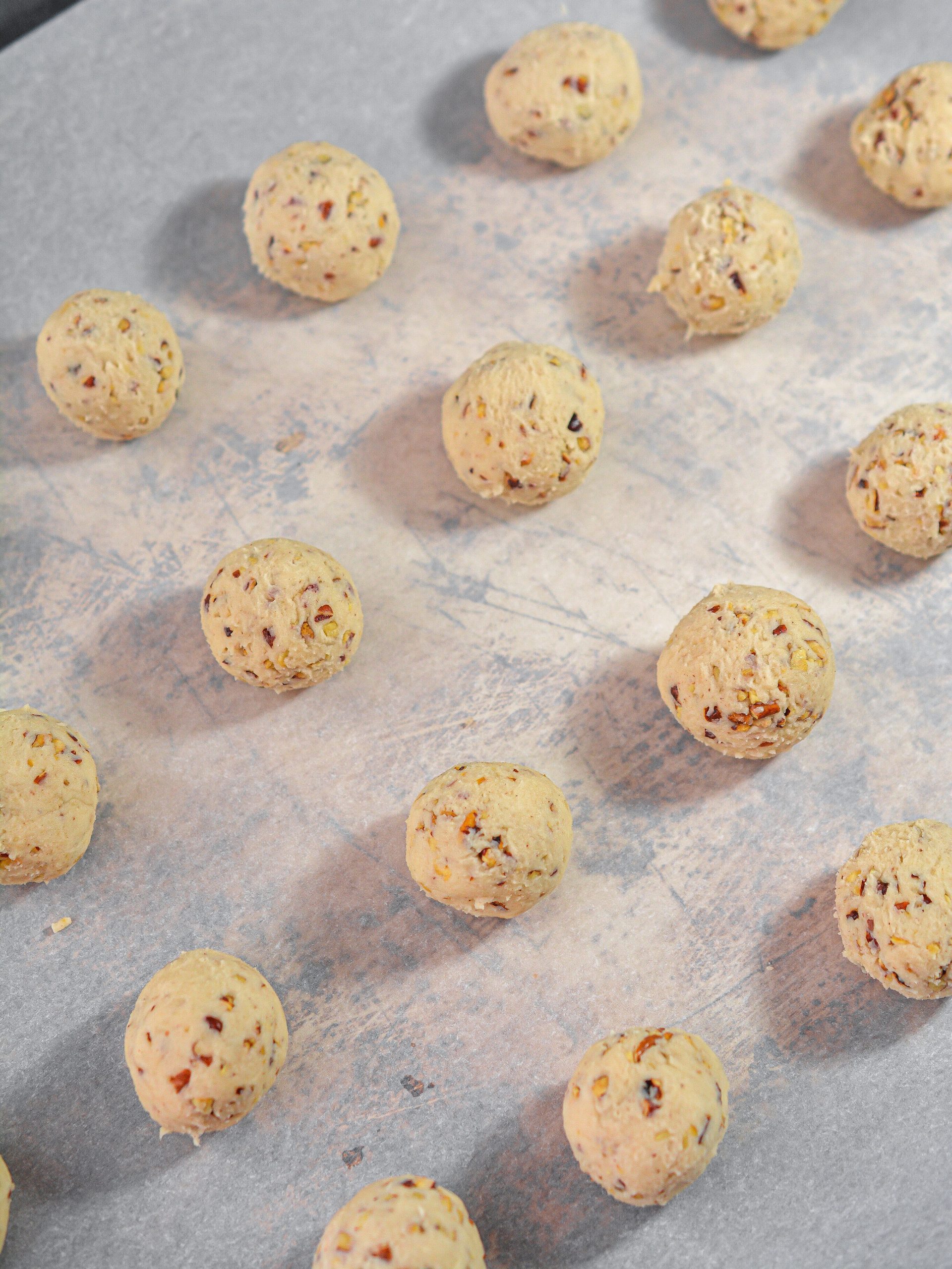 Wet your hands and form the dough into 36 evenly-sized balls of dough.