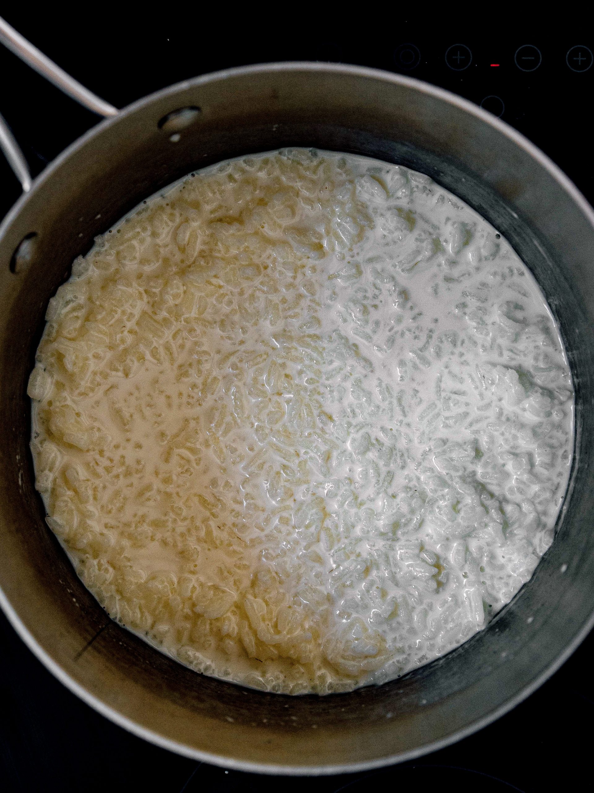 Over medium-low heat, using a saucepan combine milk, sugar, and rice.