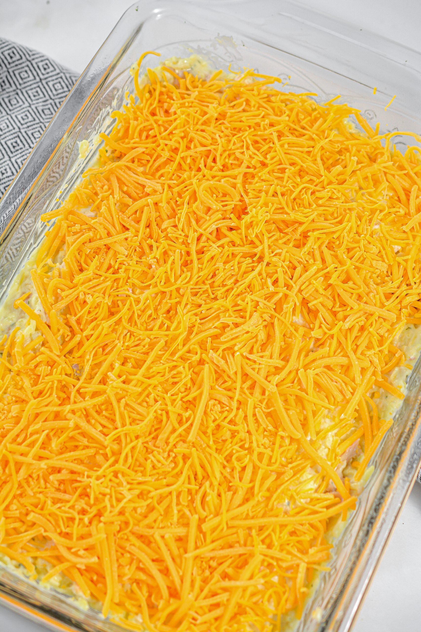 Top with shredded cheese and bake for 40 minutes.