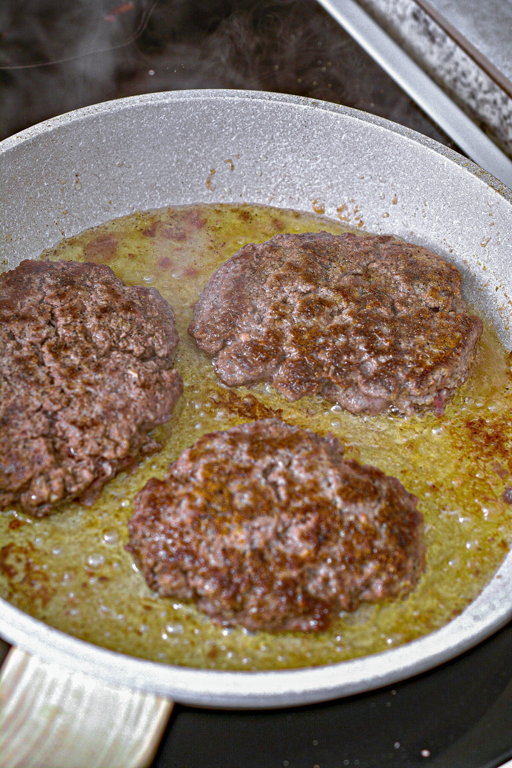 Cook the patties over medium-high heat on the stove until cooked through. Remove from the pan.