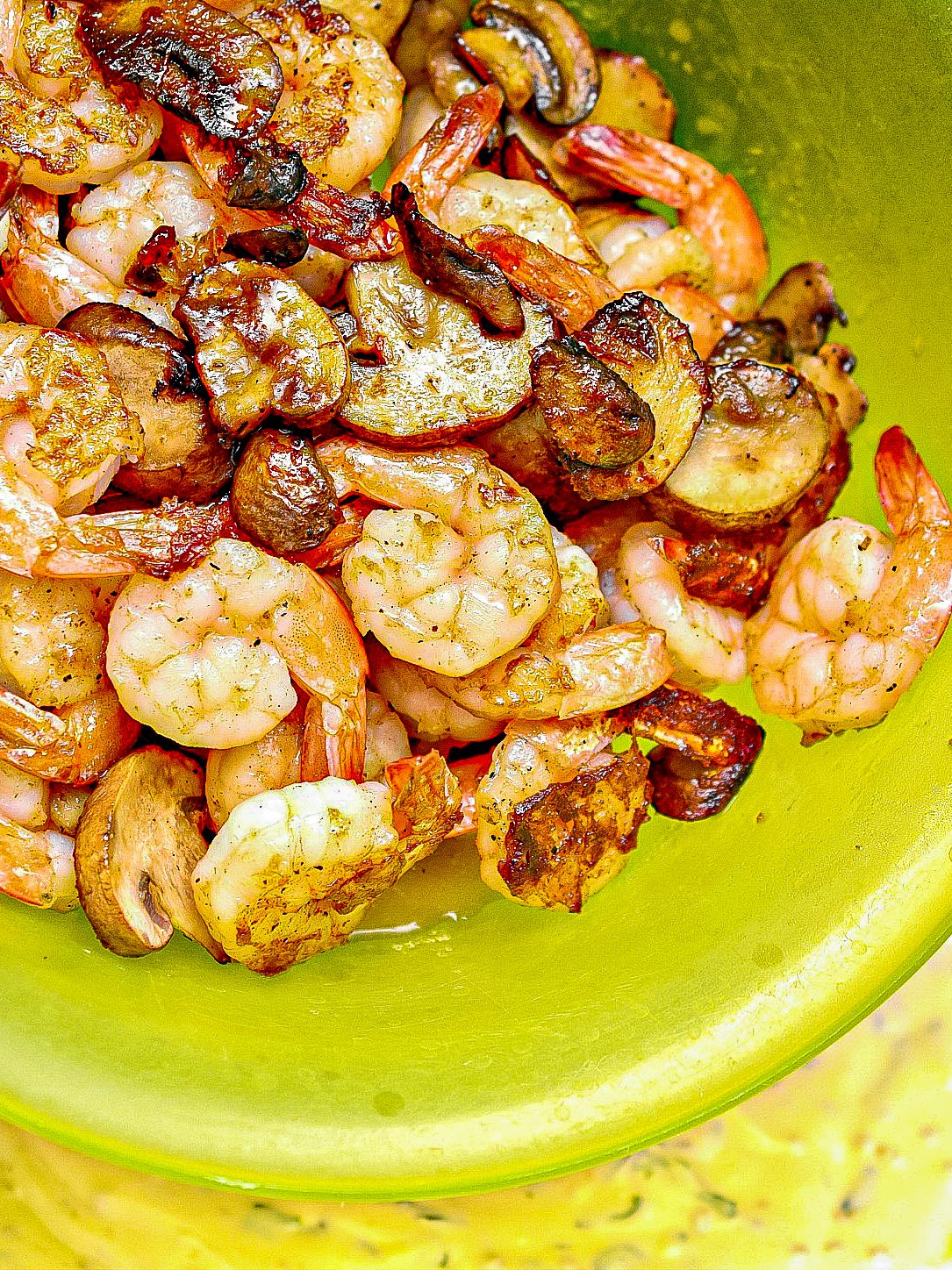 Add the shrimp and mushrooms to the skillet, stirring to coat well in the sauce.