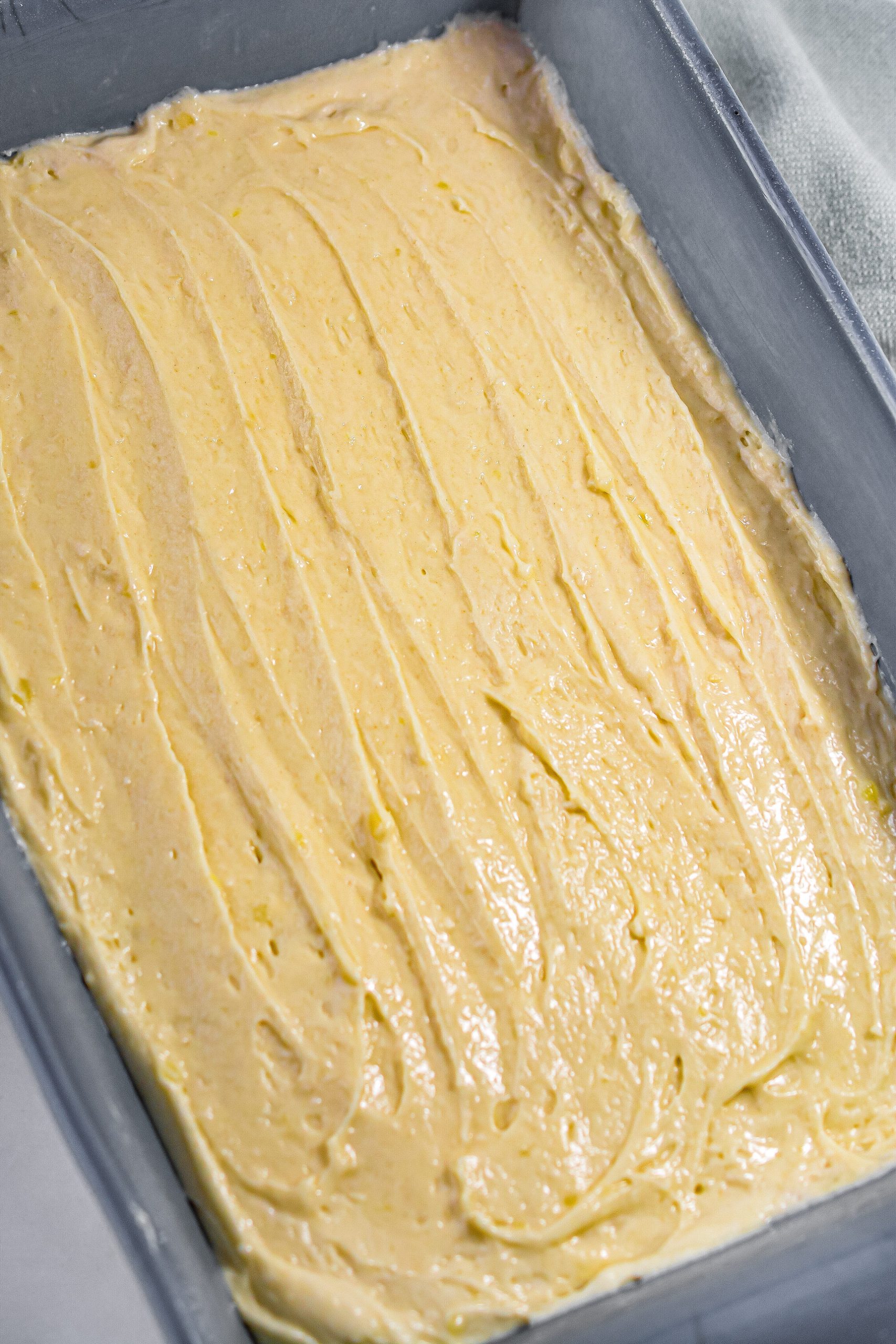add it in a smooth layer to a well-greased 9x13 baking dish