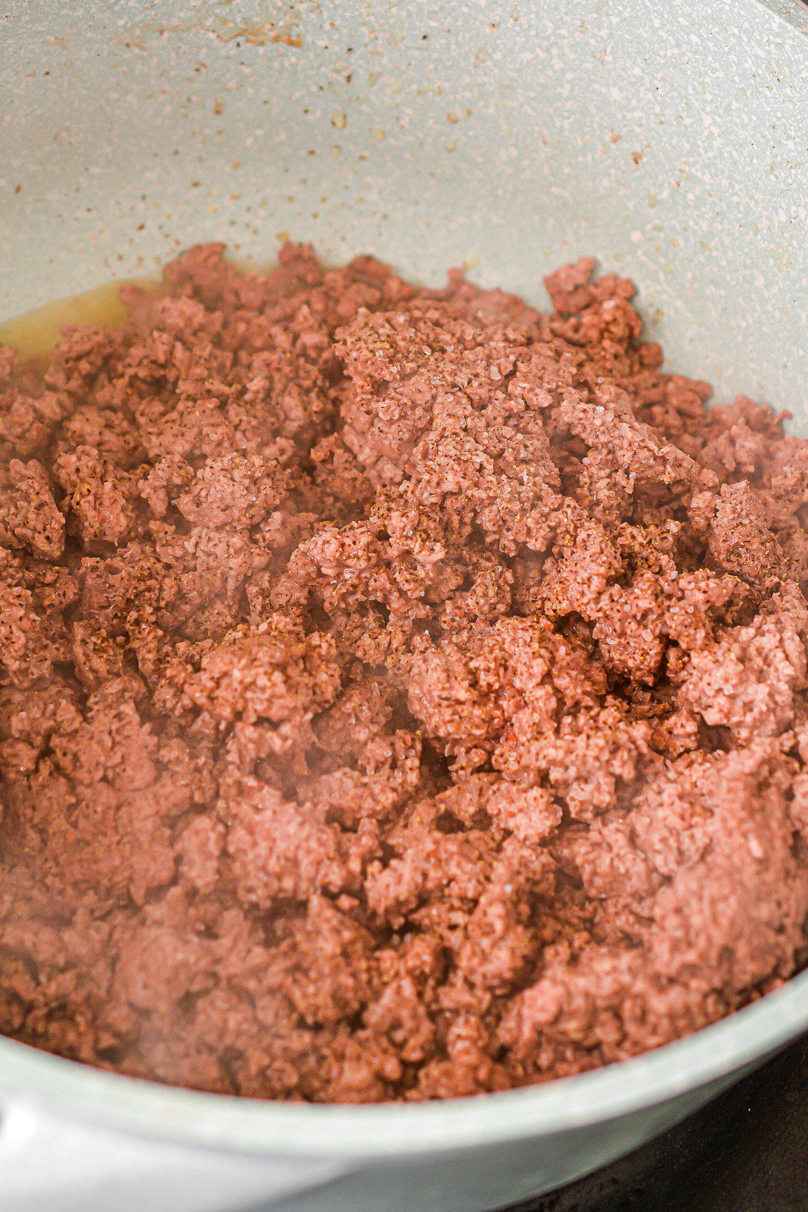 Brown the ground beef until fully cooked and drain any excess grease.