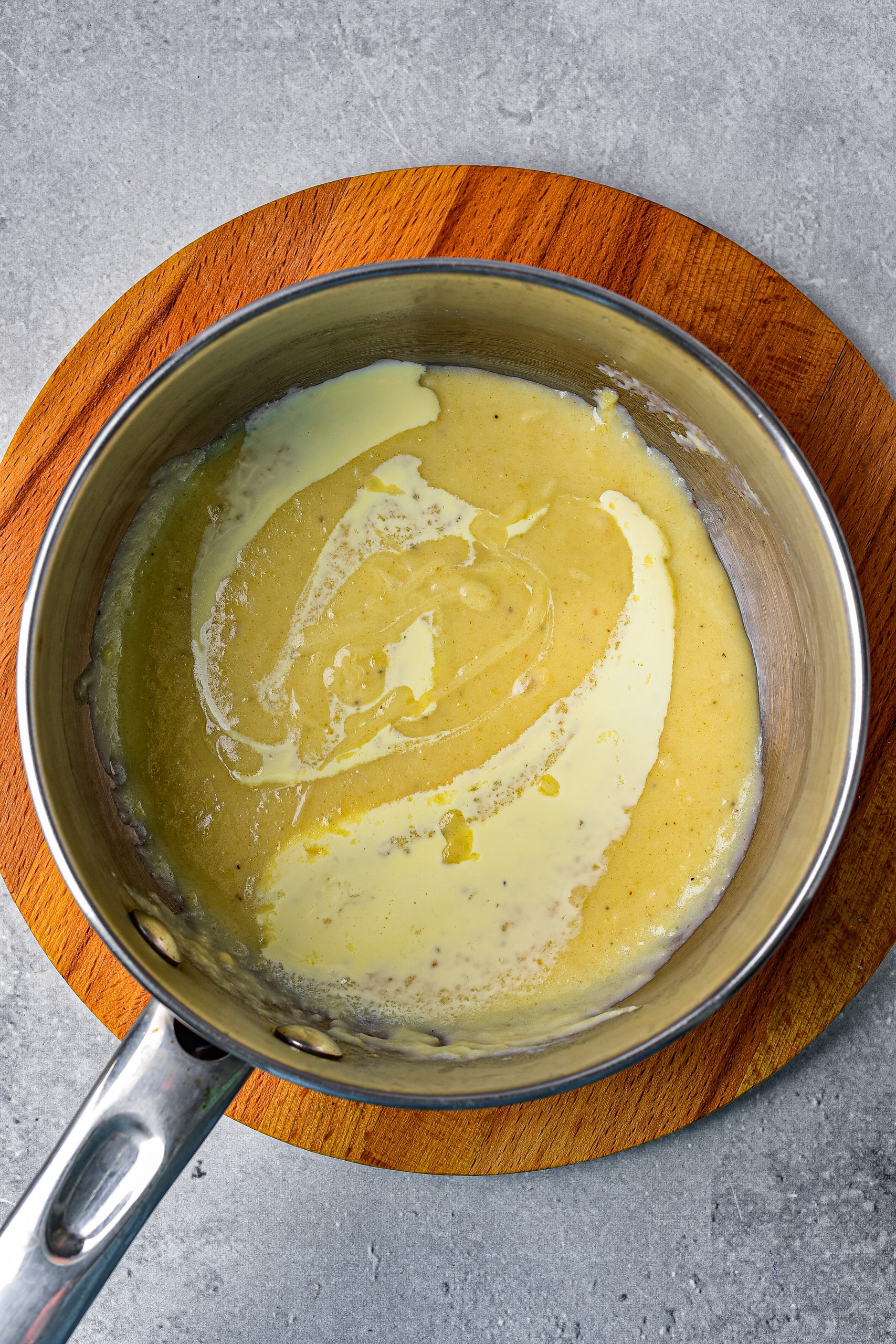 Remove the mixture from the heat, and stir in the sour cream or heavy whipping cream. 
