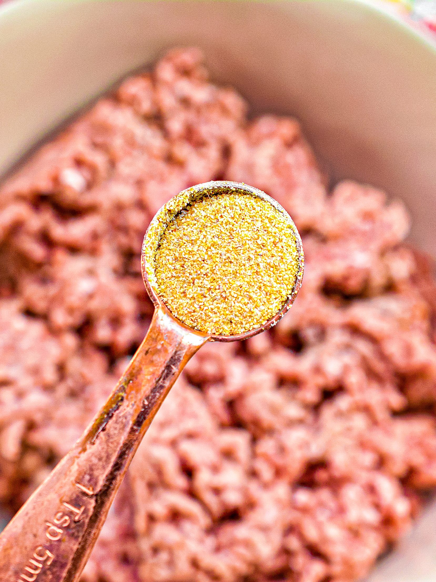 Place 1 ½ lb. of ground beef into a mixing bowl, season it with ½ tsp of garlic powder, salt, and pepper, and mix with your hands to combine well.