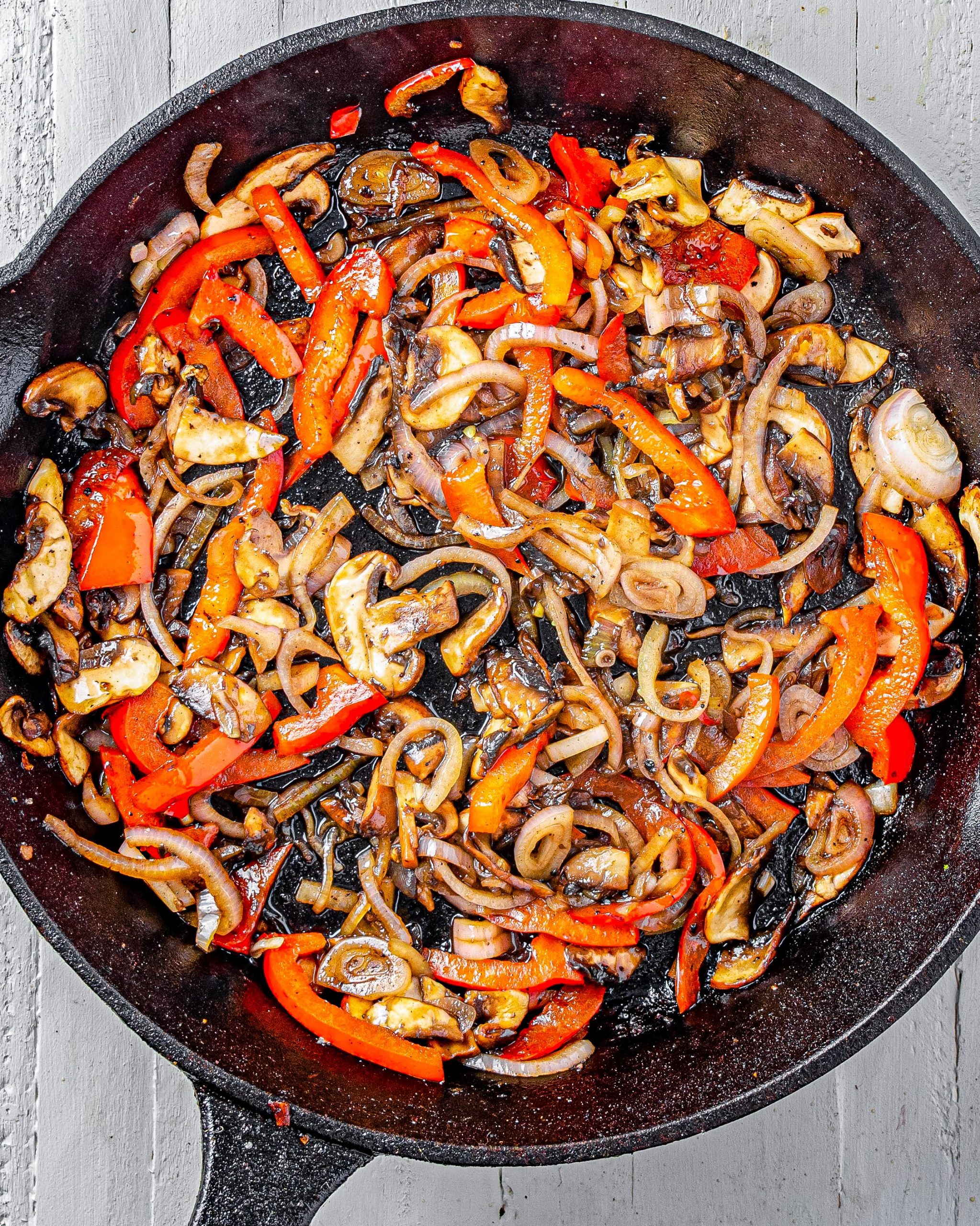 Add the mushrooms, red bell pepper, and onion to the skillet, and saute until becoming tender. 