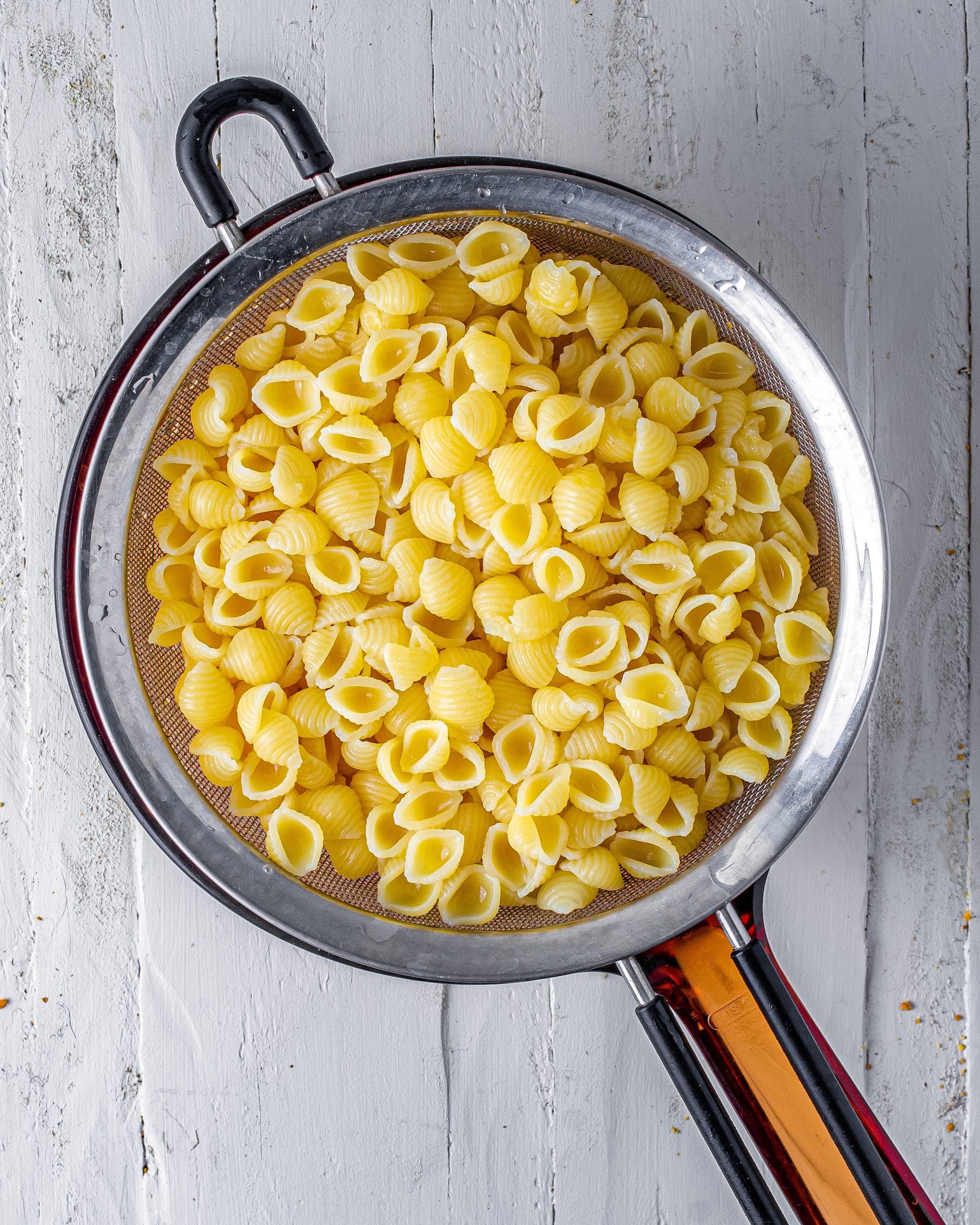 Add the pasta to boiling water, and cook until done to your liking. Rinse under cold water, and drain well. 