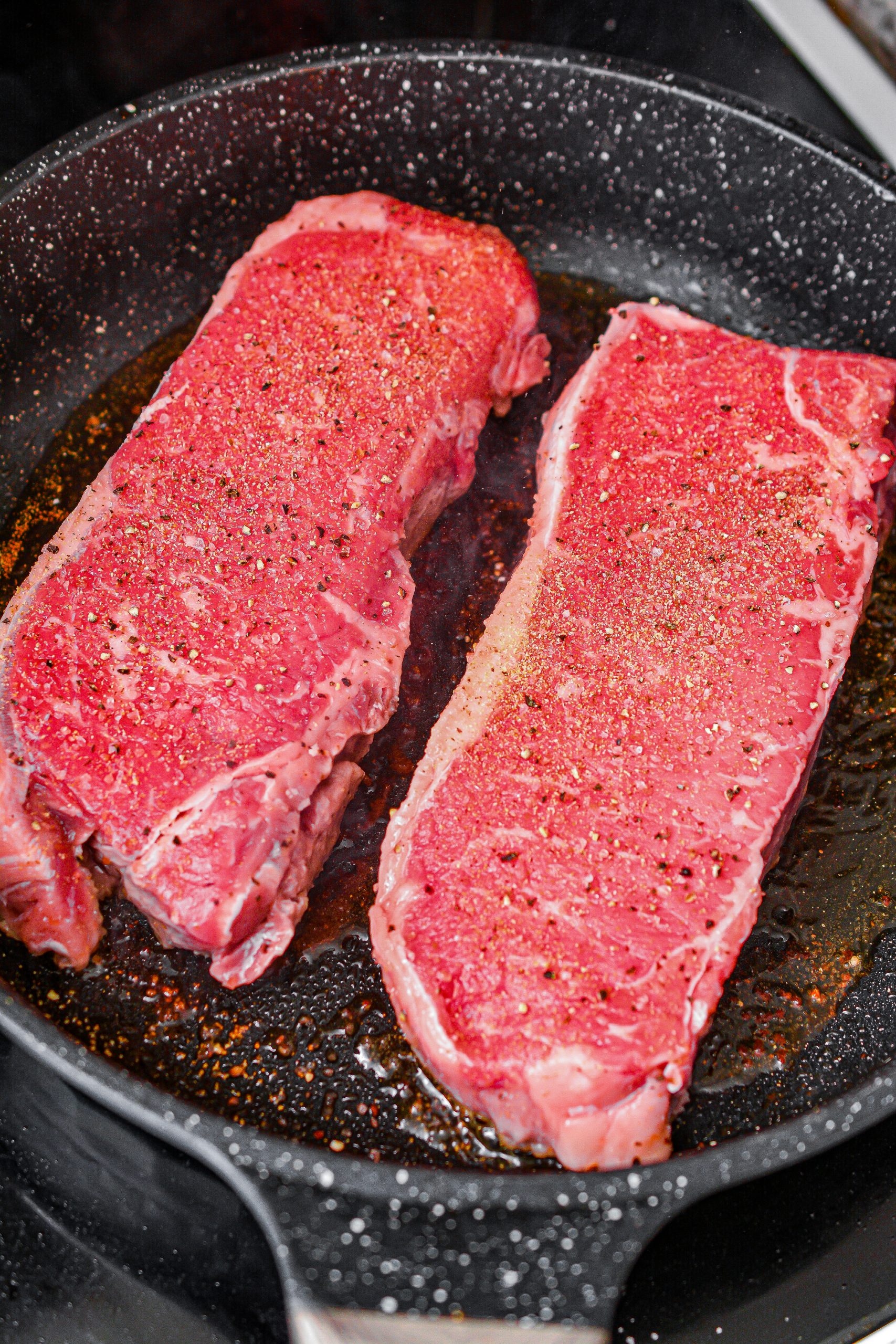 Heat 1 Tbsp. oil in a skillet over medium-high heat, and cook the steak seasoned with salt, pepper, and garlic powder, until done to your liking.