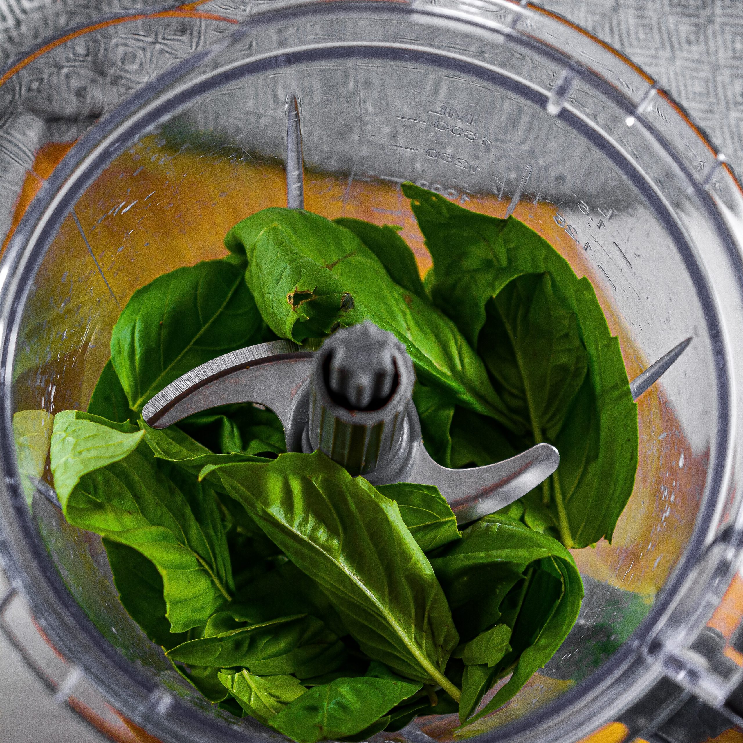 In a blender or food processor add the fresh basil leaves.