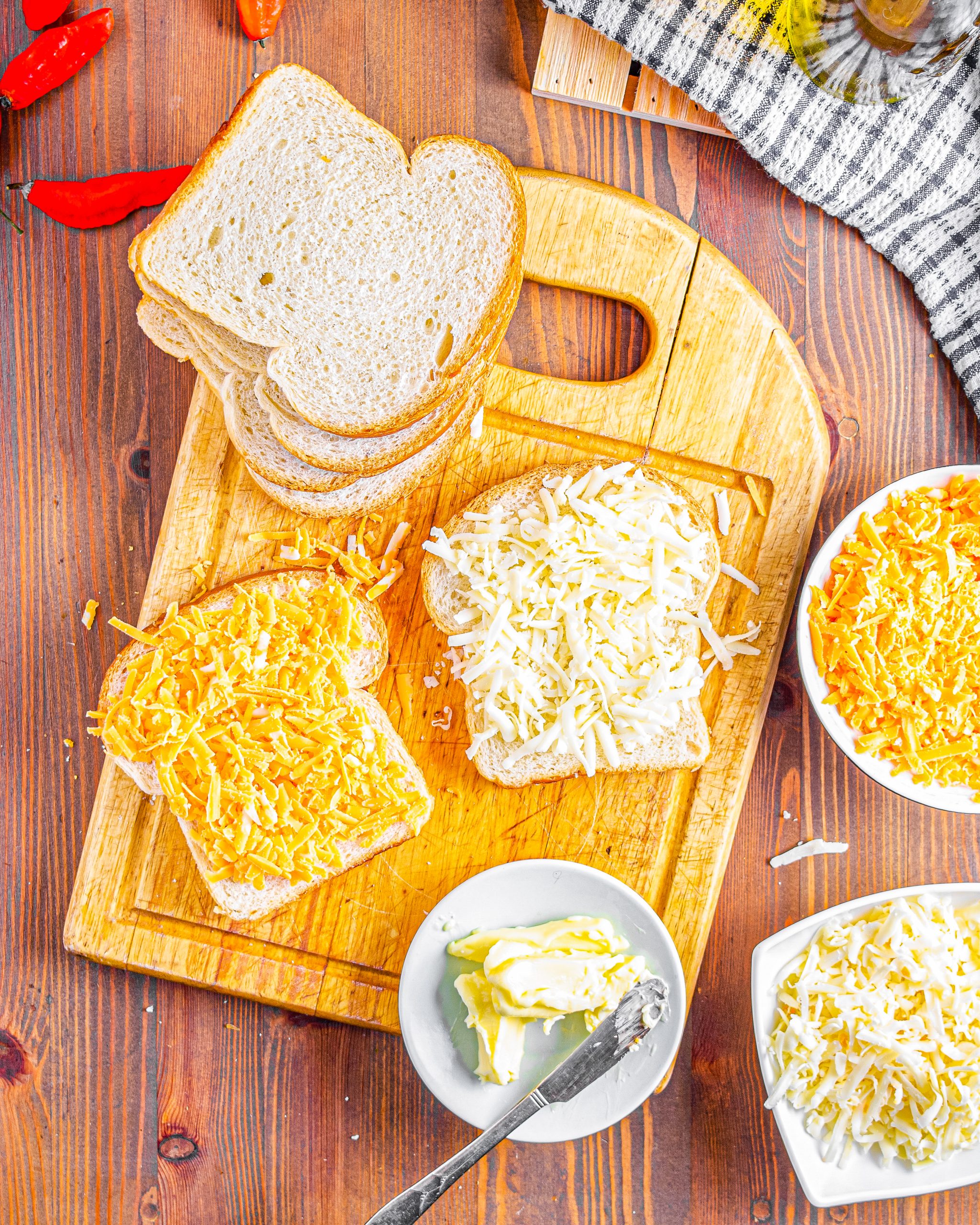 Add cheddar cheese to one of the slices of bread.
