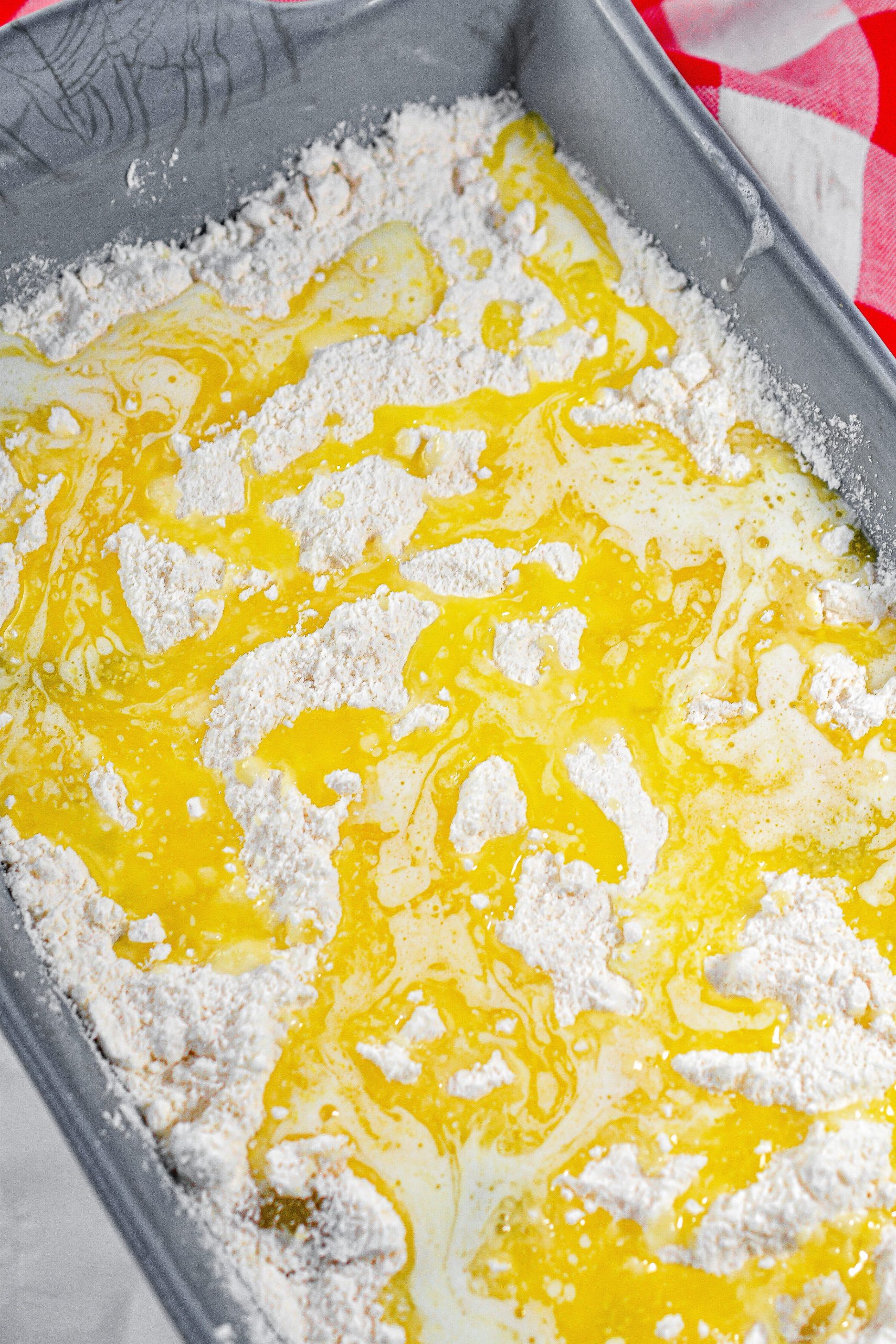 Drizzle the butter over the top of the cake mix.