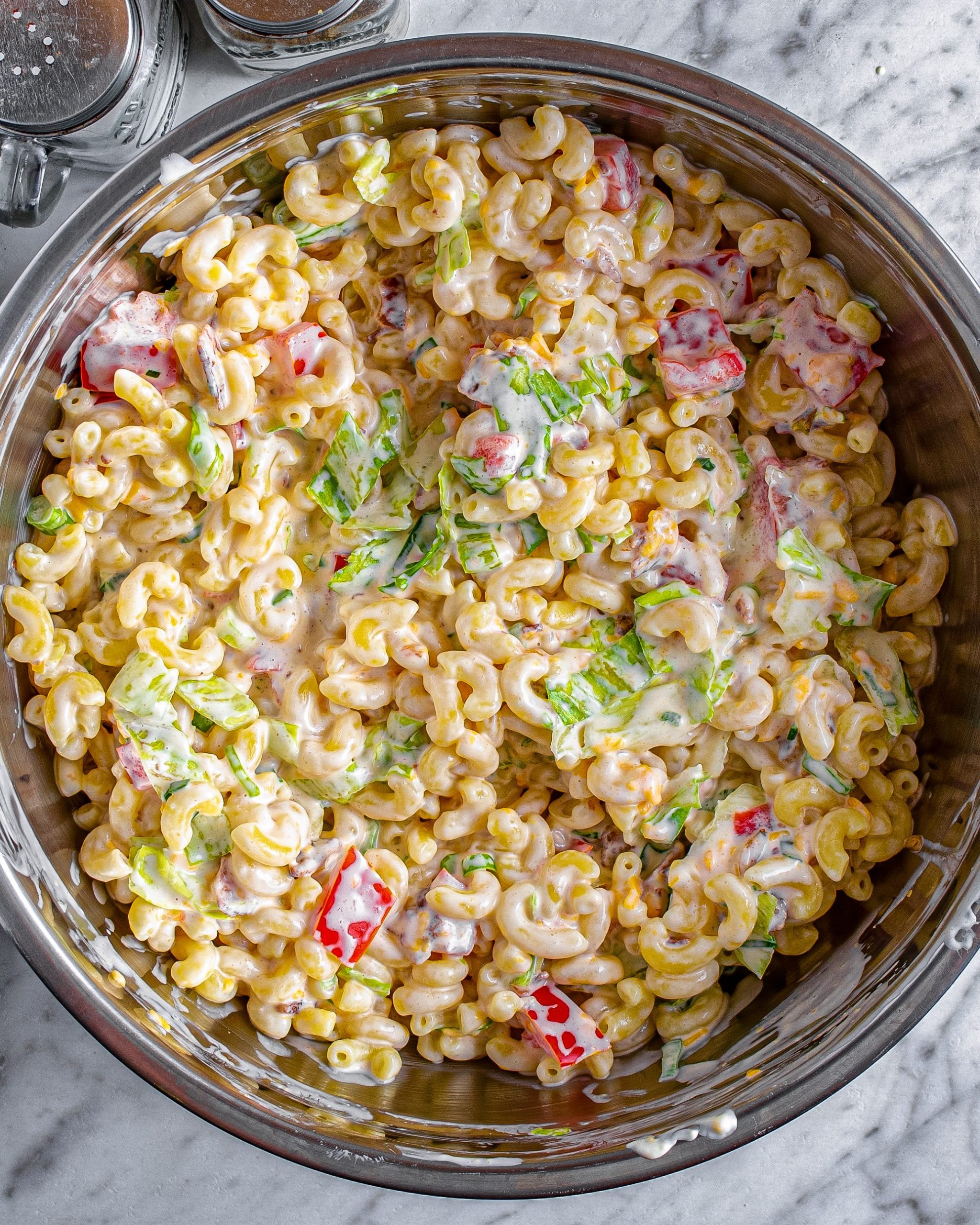 Once cooled and fully drained, add the pasta to the mixing bowl, and mix to combine. 