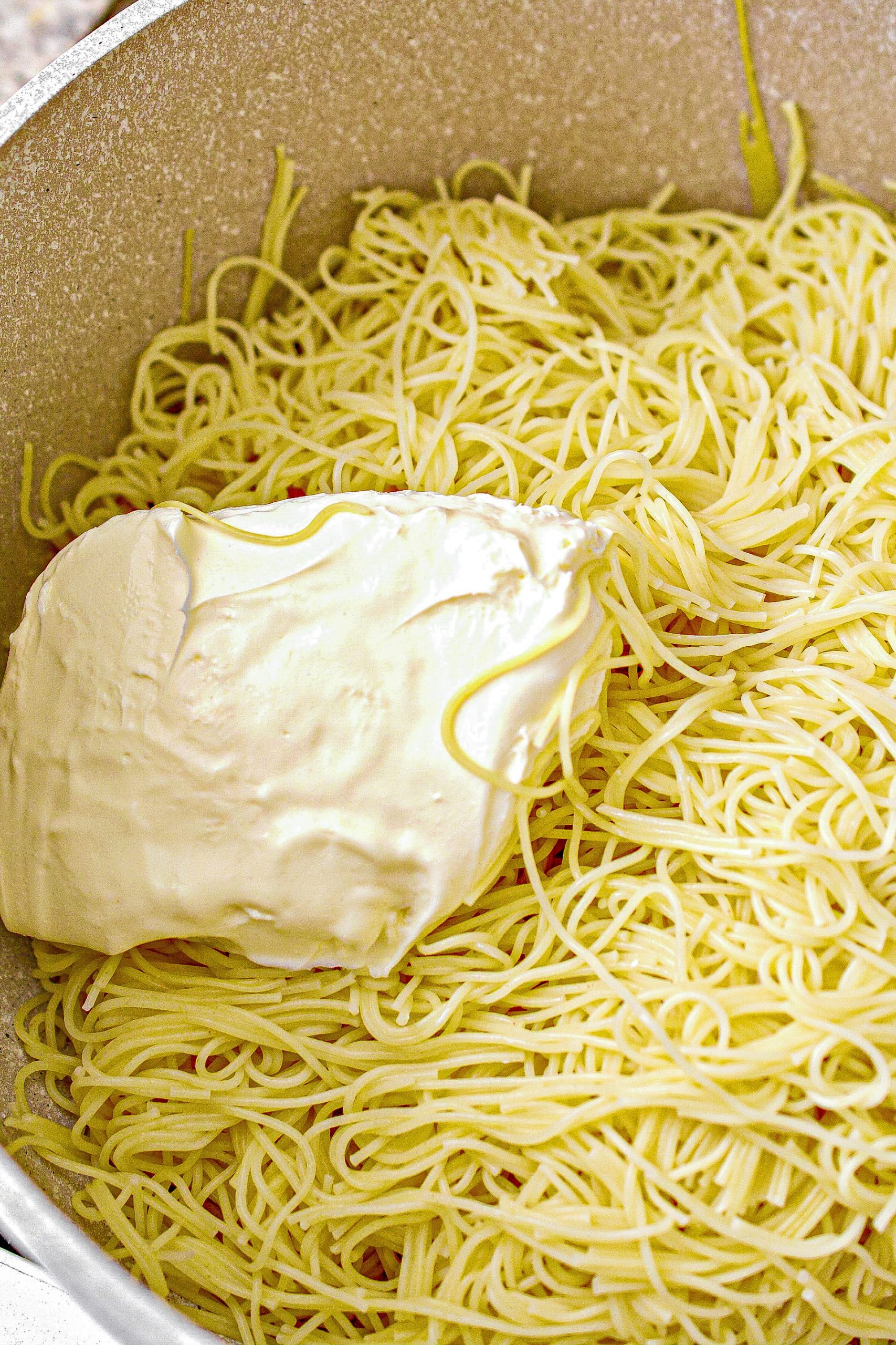 Return the spaghetti to the pot, and mix with the cream cheese until combined.