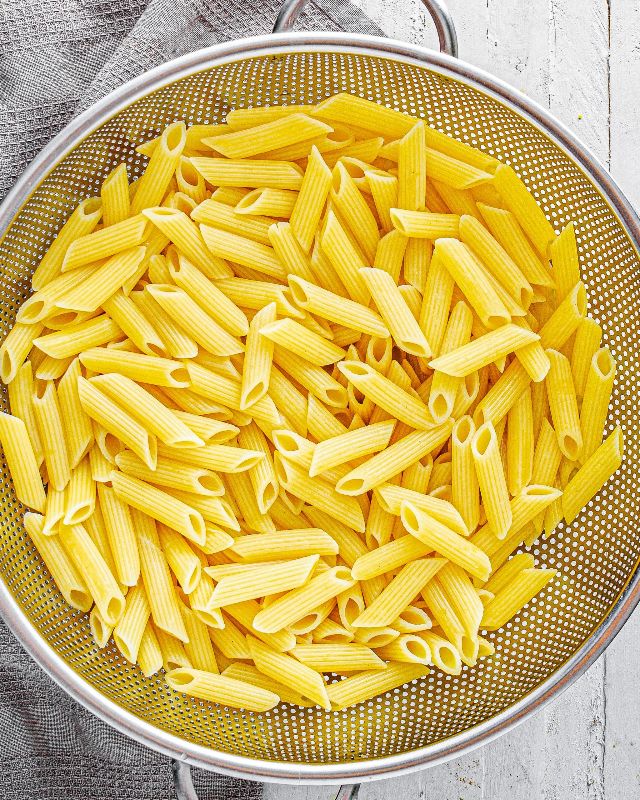 Cook the penne pasta in boiling water to your liking, and strain completely.