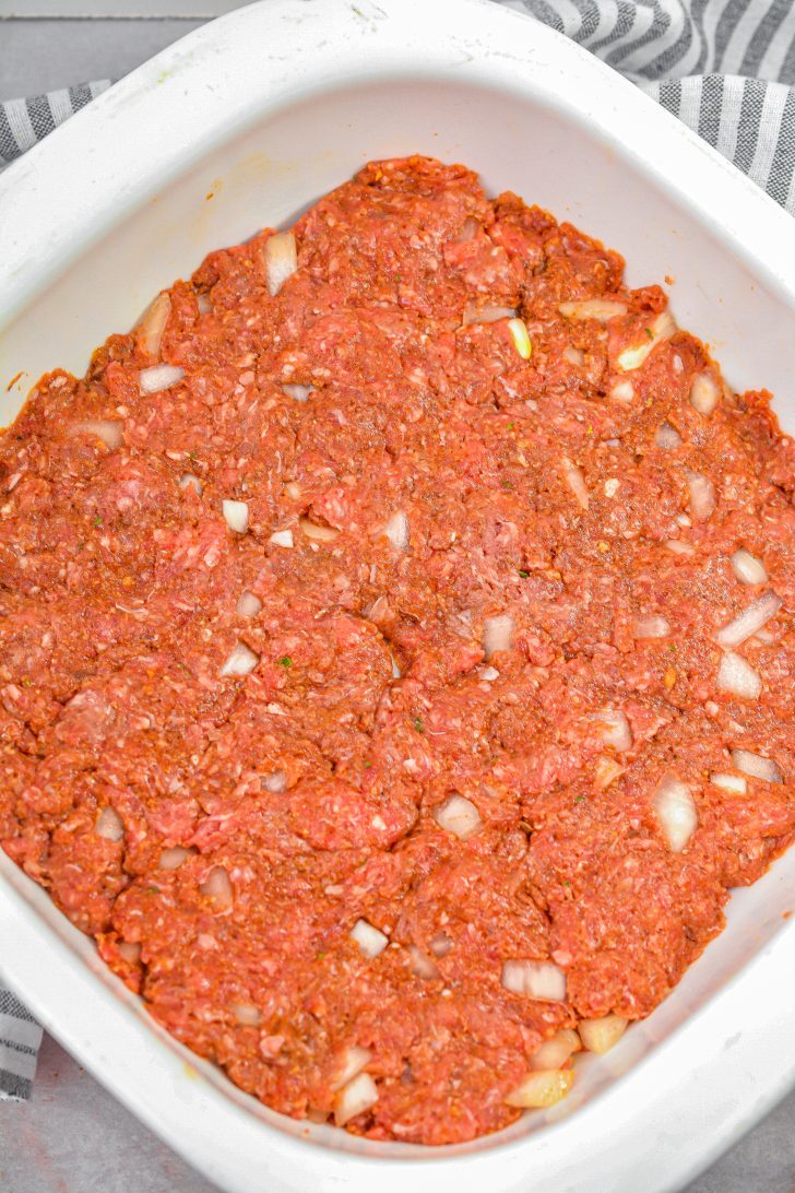 Press the meat mixture into a 9x9 well-greased baking dish.