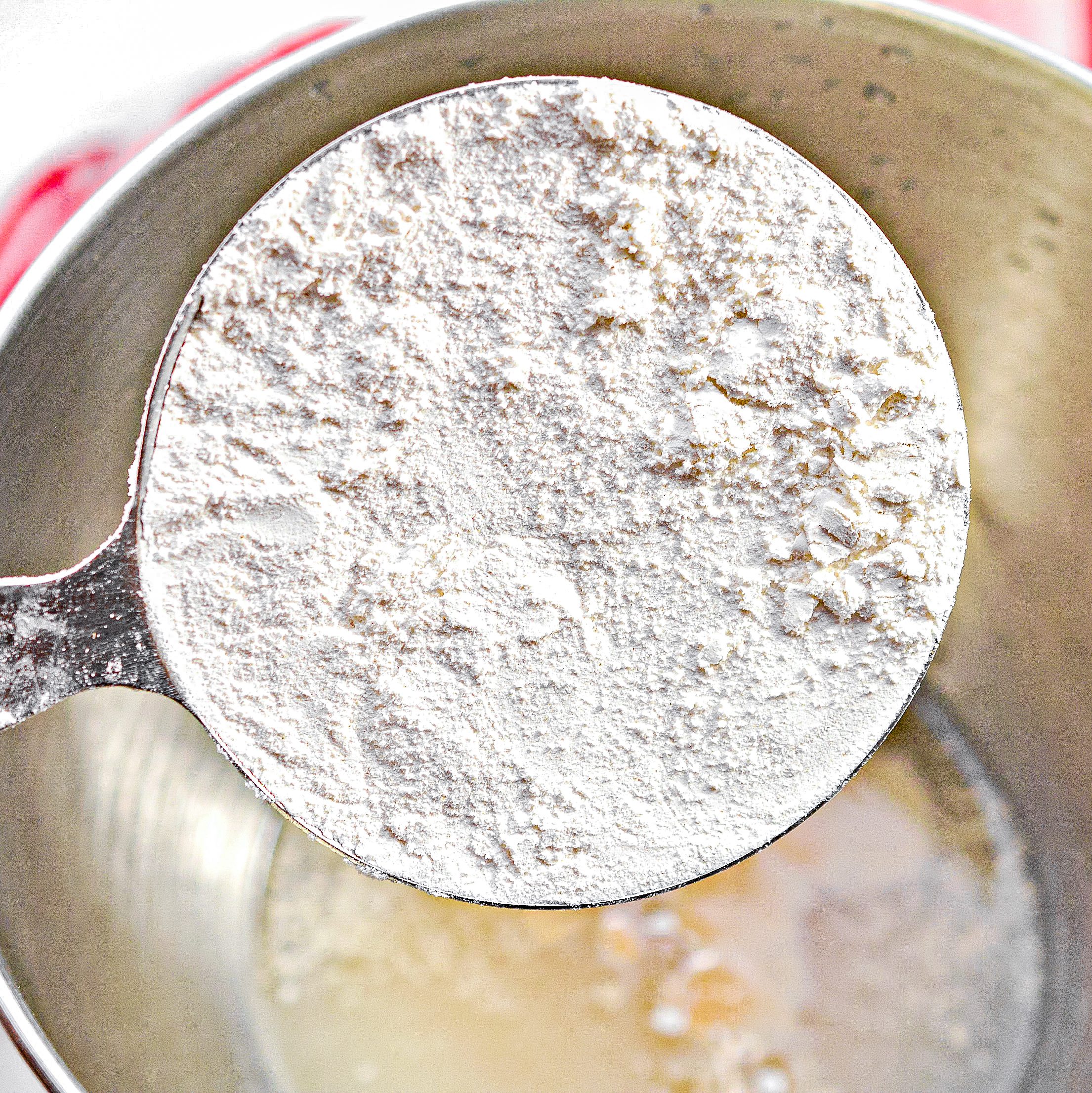 Place 2 cups of flour into the mixing bowl with the yeast mixture.