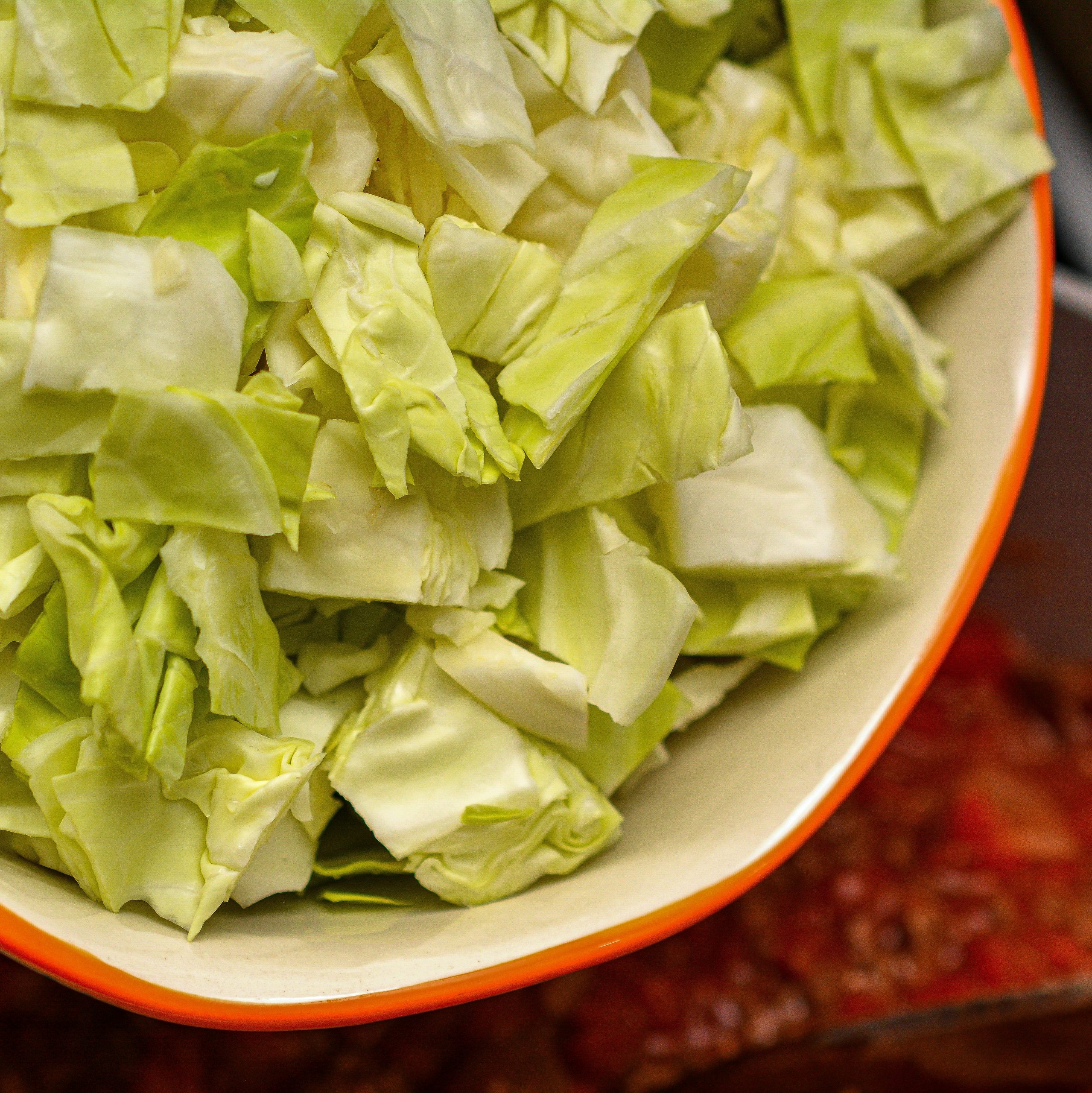 add the cabbage along with salt and pepper to taste, and stir to combine.