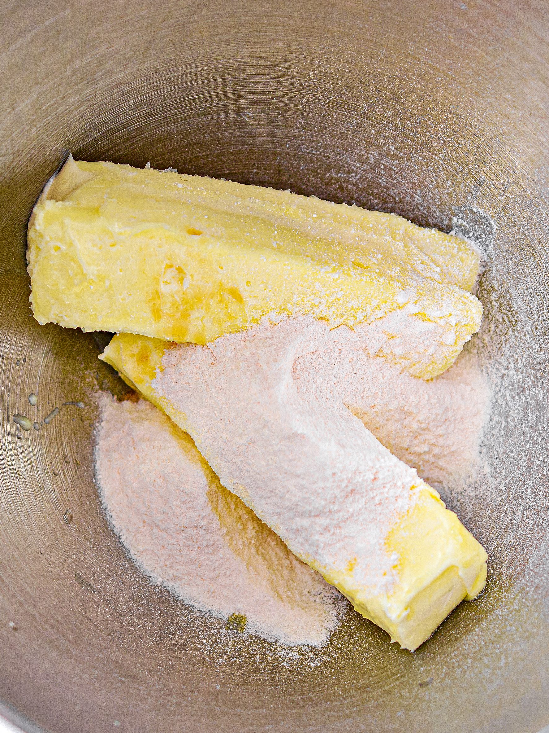 Mix together the 2 sticks of butter and the cheesecake pudding mix together until creamy.