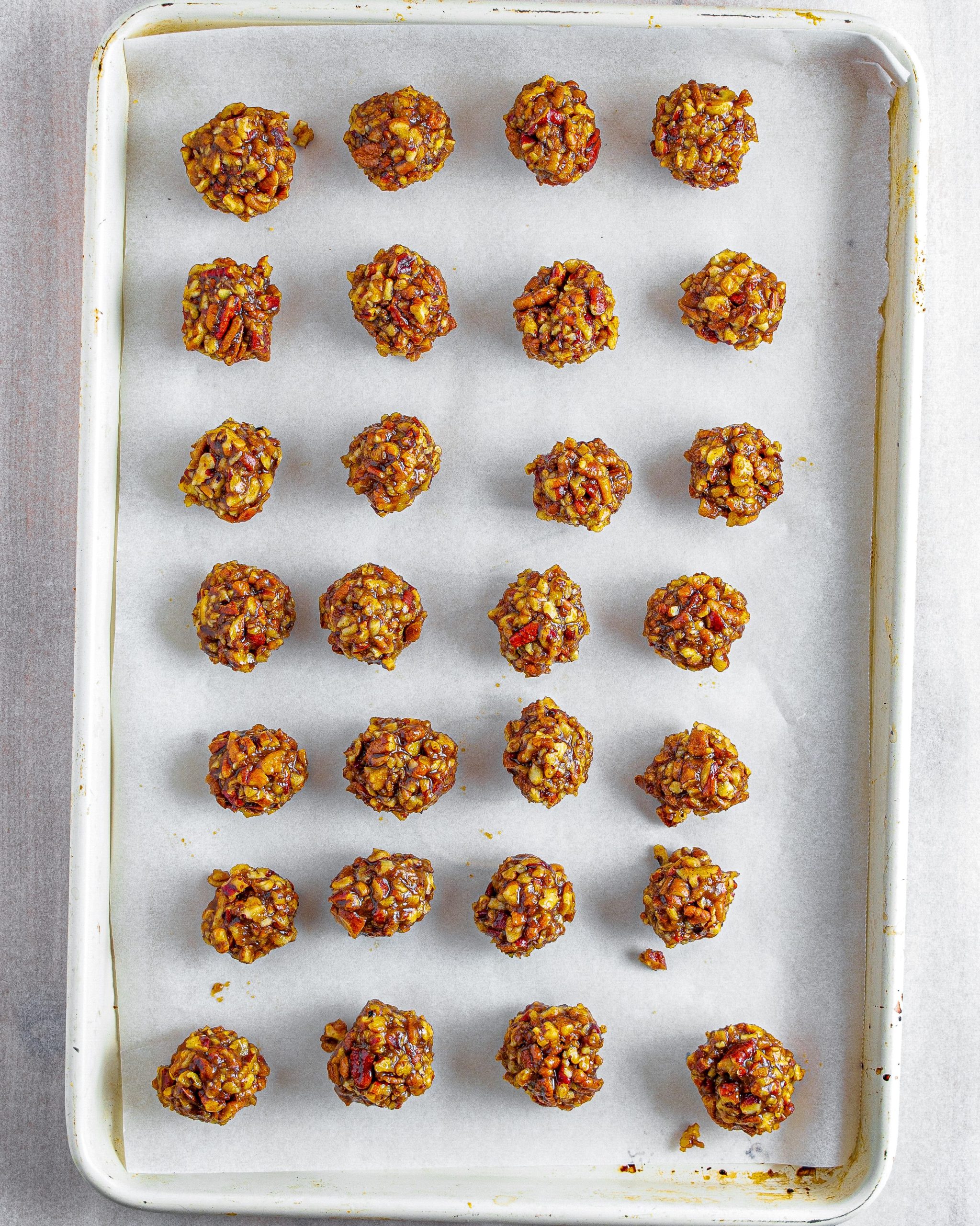 Form the mixture into 30 evenly sized balls and place into the freezer to chill on a parchment-lined baking sheet for 1 hour.