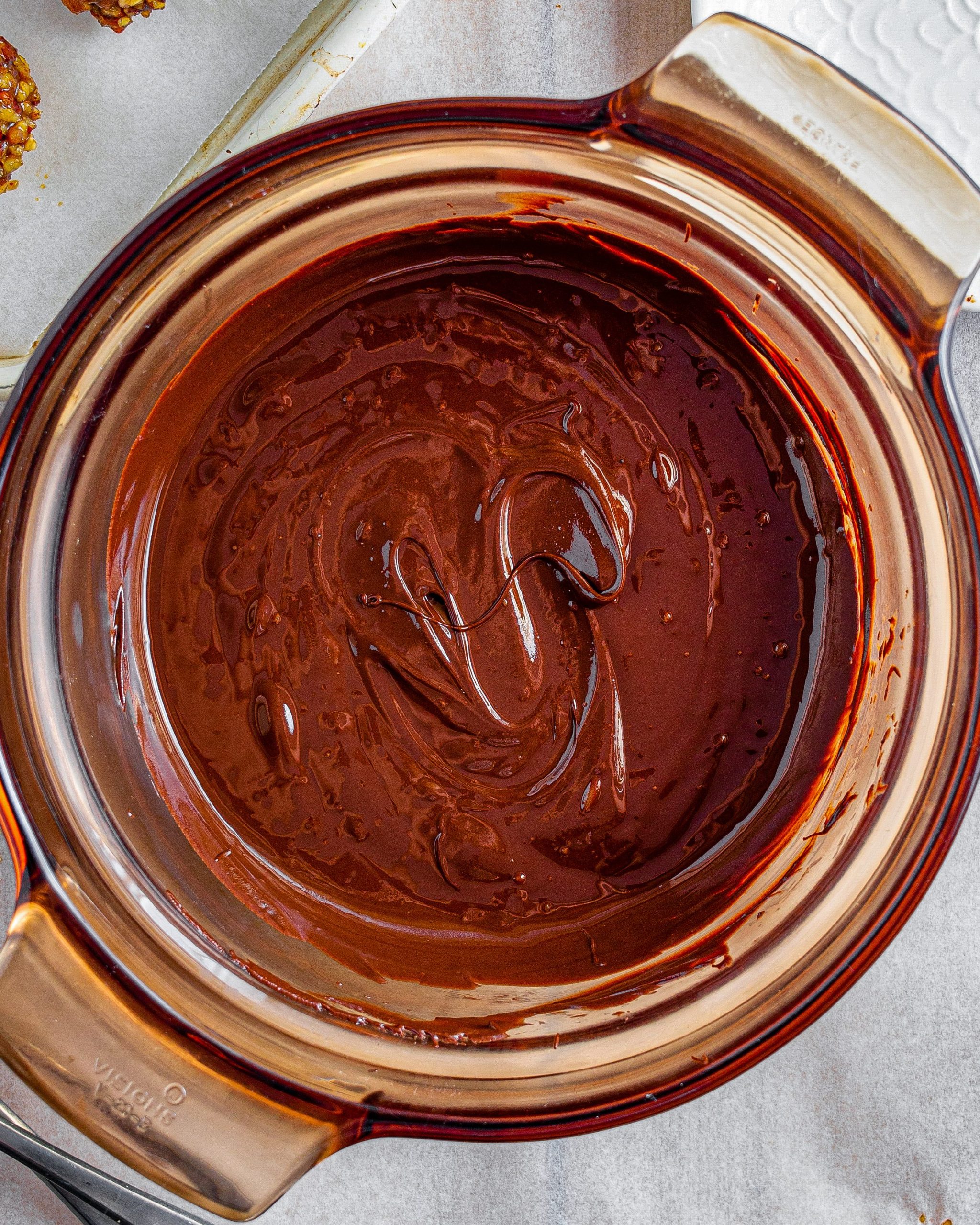 Heat the chocolate in a microwave-safe bowl at 30-second intervals until completely melted.