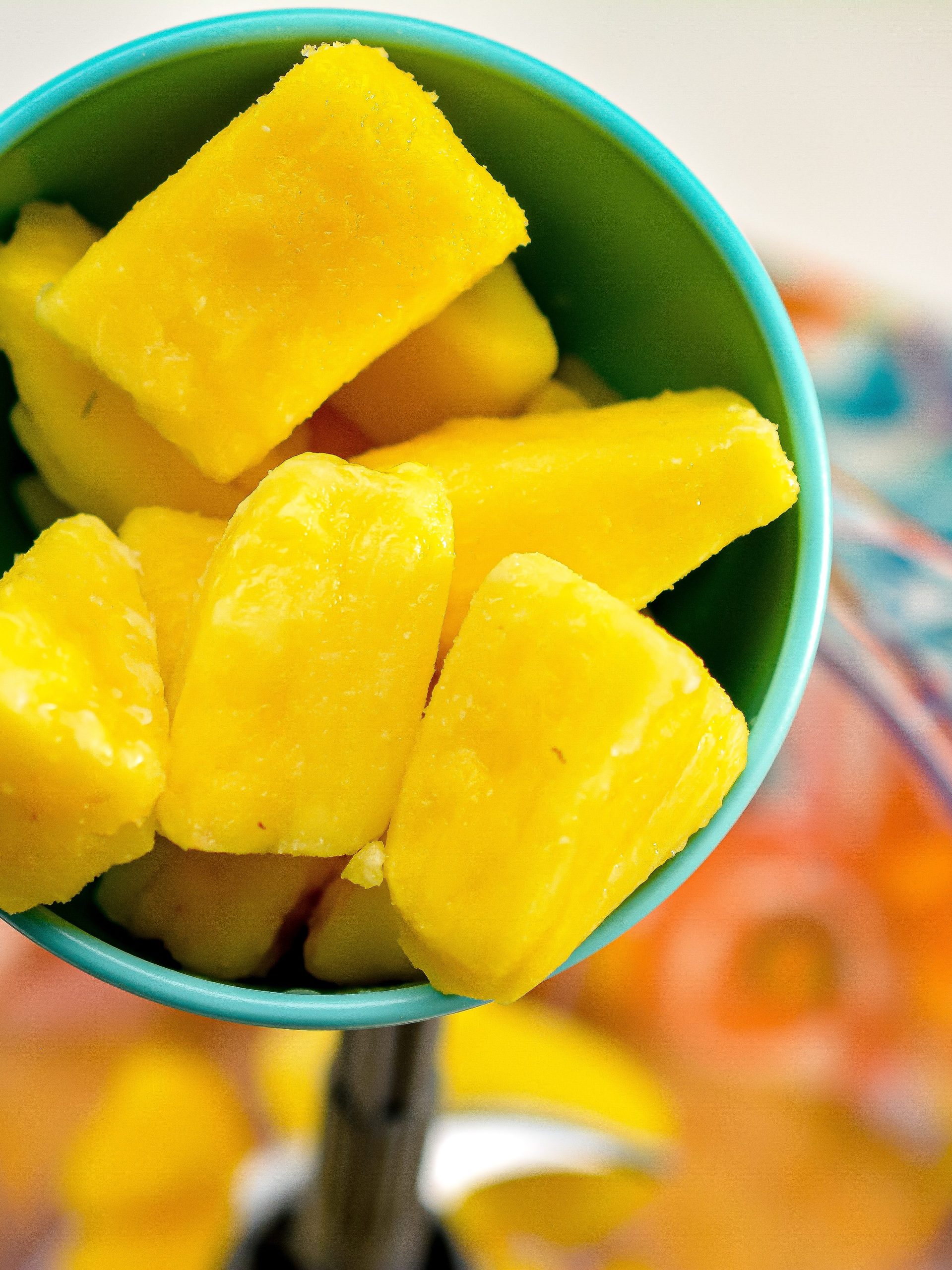 Start by adding 3 cups of frozen pineapple chunks into a blender or food processor.