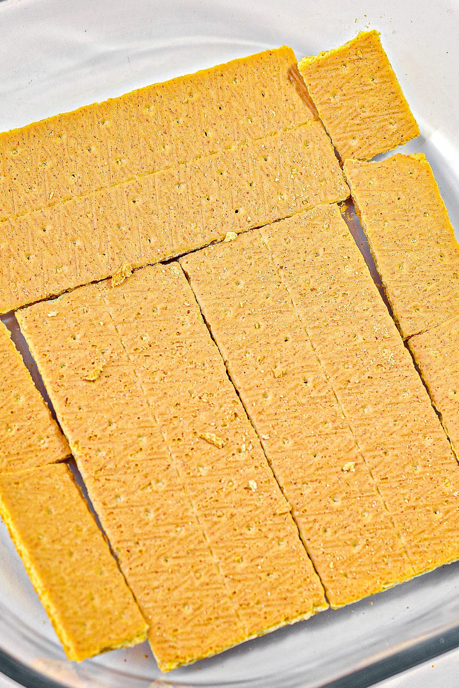 Place a layer of graham crackers in the bottom of a 9x9 baking dish. You can break the graham crackers up as needed to line it completely.